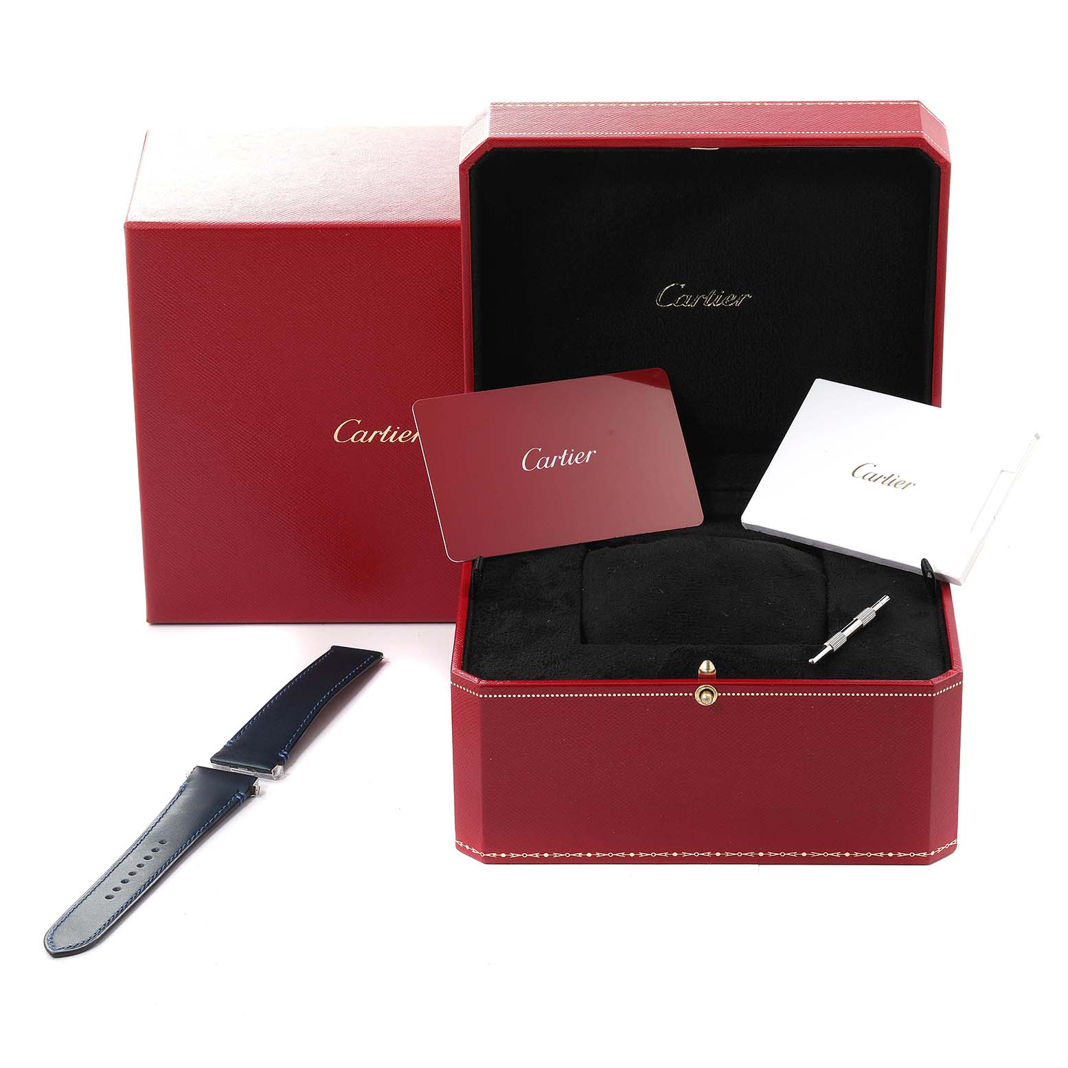 This image shows the packaging and accessories of a Cartier Santos WSSA0030 Men's Stainless Steel Blue Dial WSSA0030 Men's Stainless Steel Blue Dial watch, including a strap, a red box, and booklets.