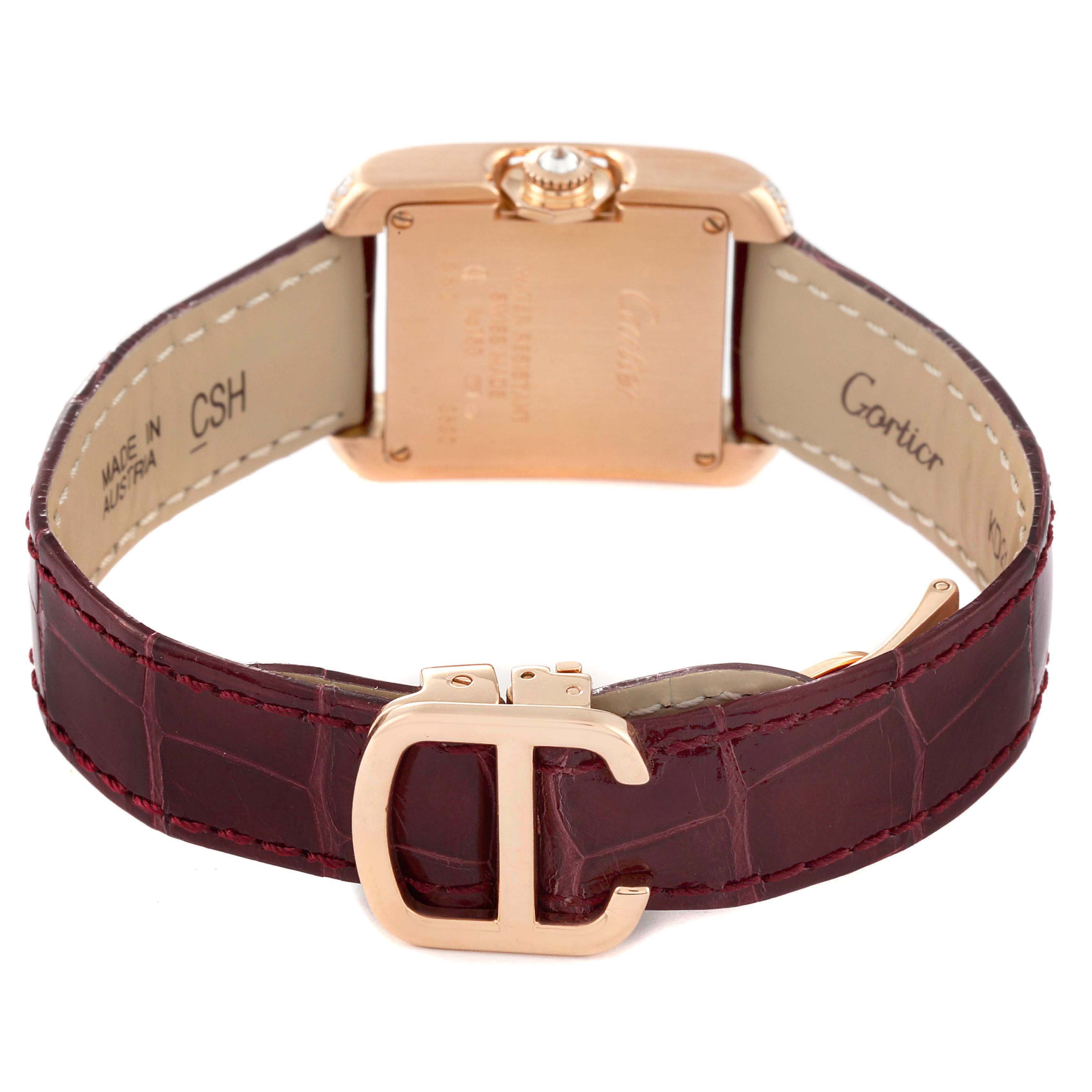 The Cartier Tank Anglaise WT100013 Women's Rose Gold Silver Dial watch is shown from the back, highlighting its case, crown, and leather strap with buckle.