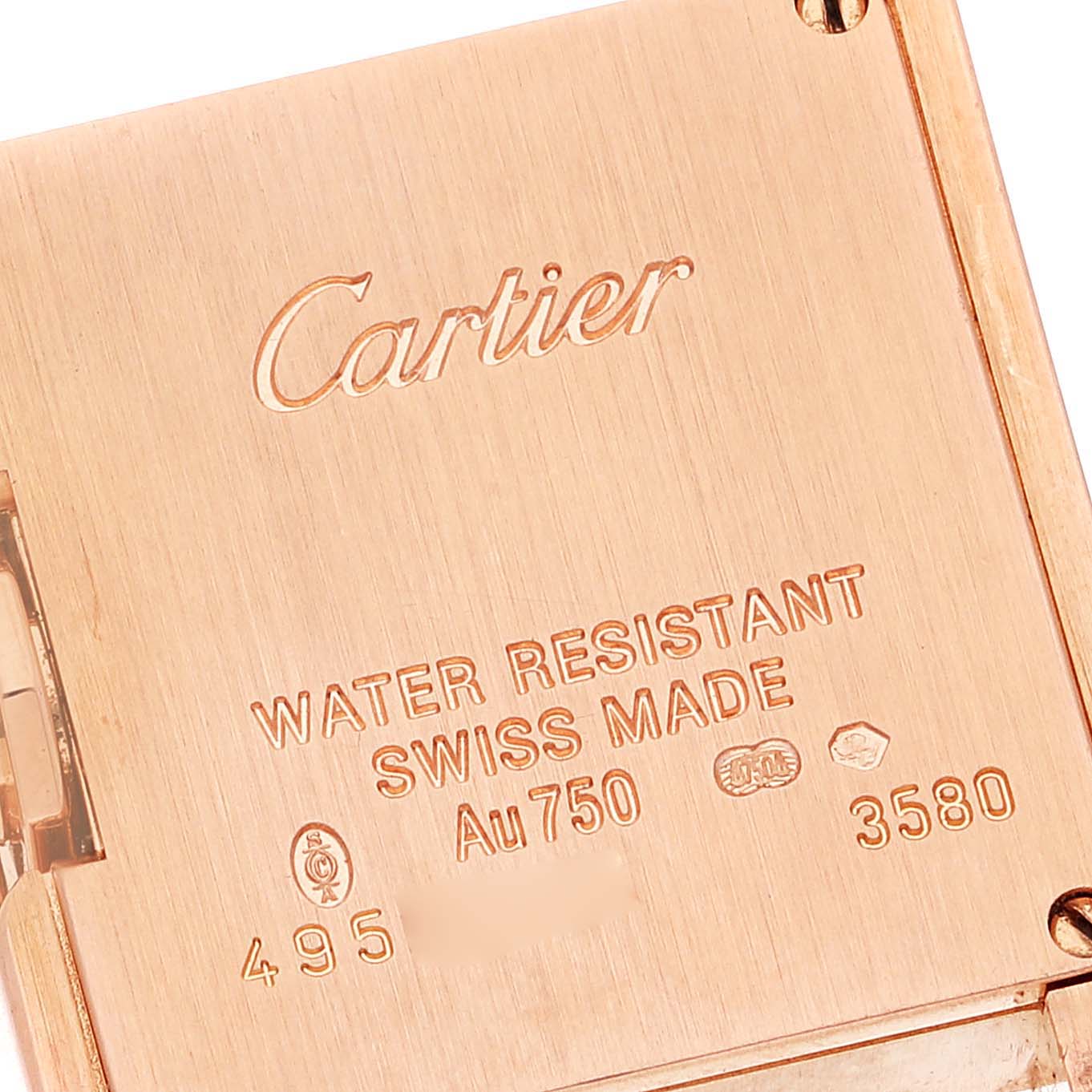 This image shows the back case of a Cartier Tank Anglaise WT100013 Women's Rose Gold Silver Dial WT100013 Women's Rose Gold Silver Dial watch, highlighting its engravings and hallmarks.
