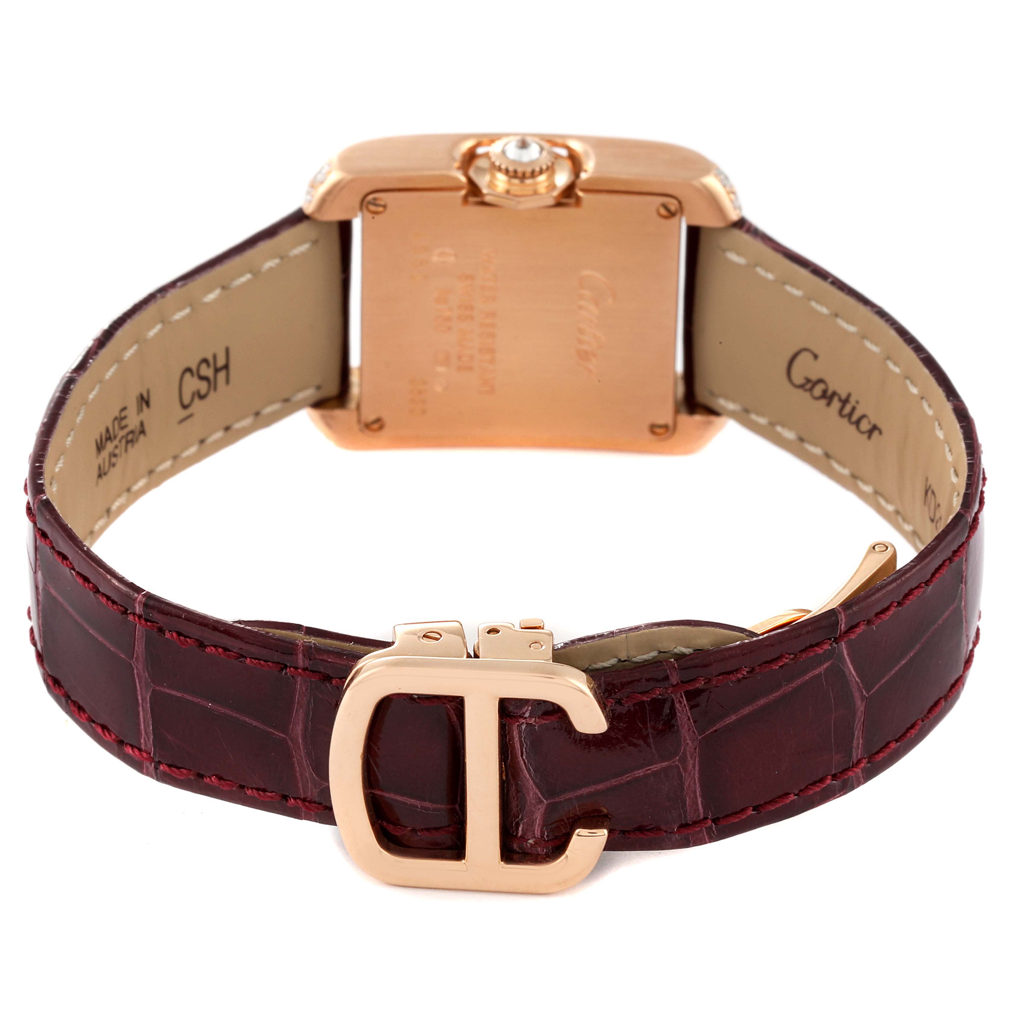 This image shows the back view of a Cartier Tank Anglaise WT100013 Women's Rose Gold Silver Dial WT100013 Women's Rose Gold Silver Dial watch with a maroon leather strap and gold clasp.