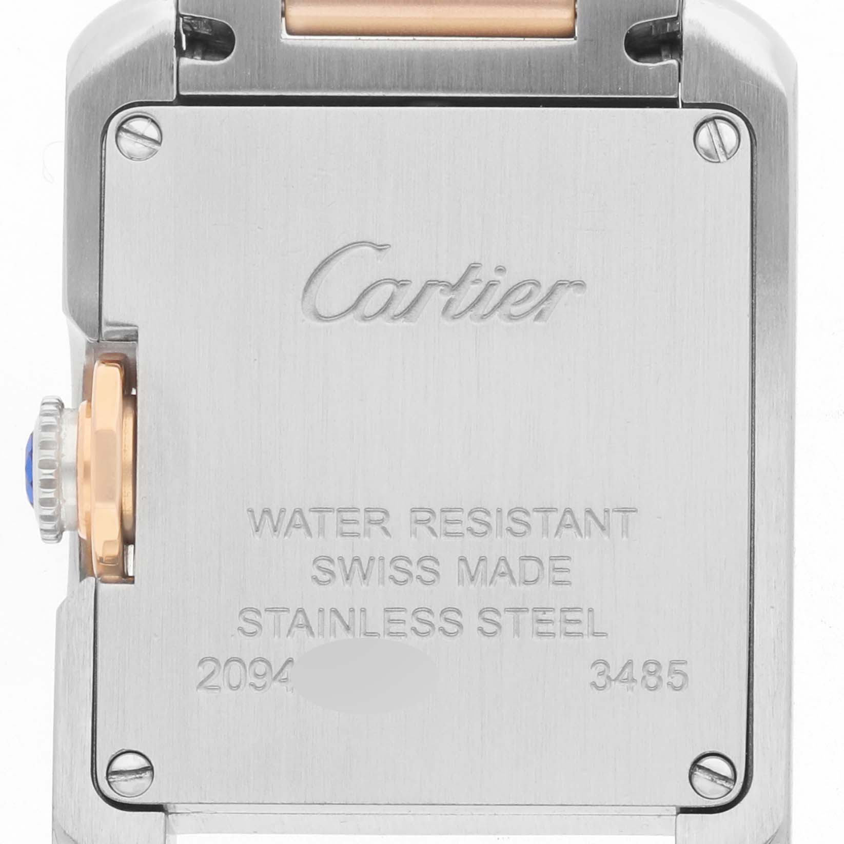 The image shows the back case of a Cartier Tank Anglaise WT100024 Women's Steel and Gold (two tone) Silver Dial watch, highlighting the stainless steel material and brand engraving.