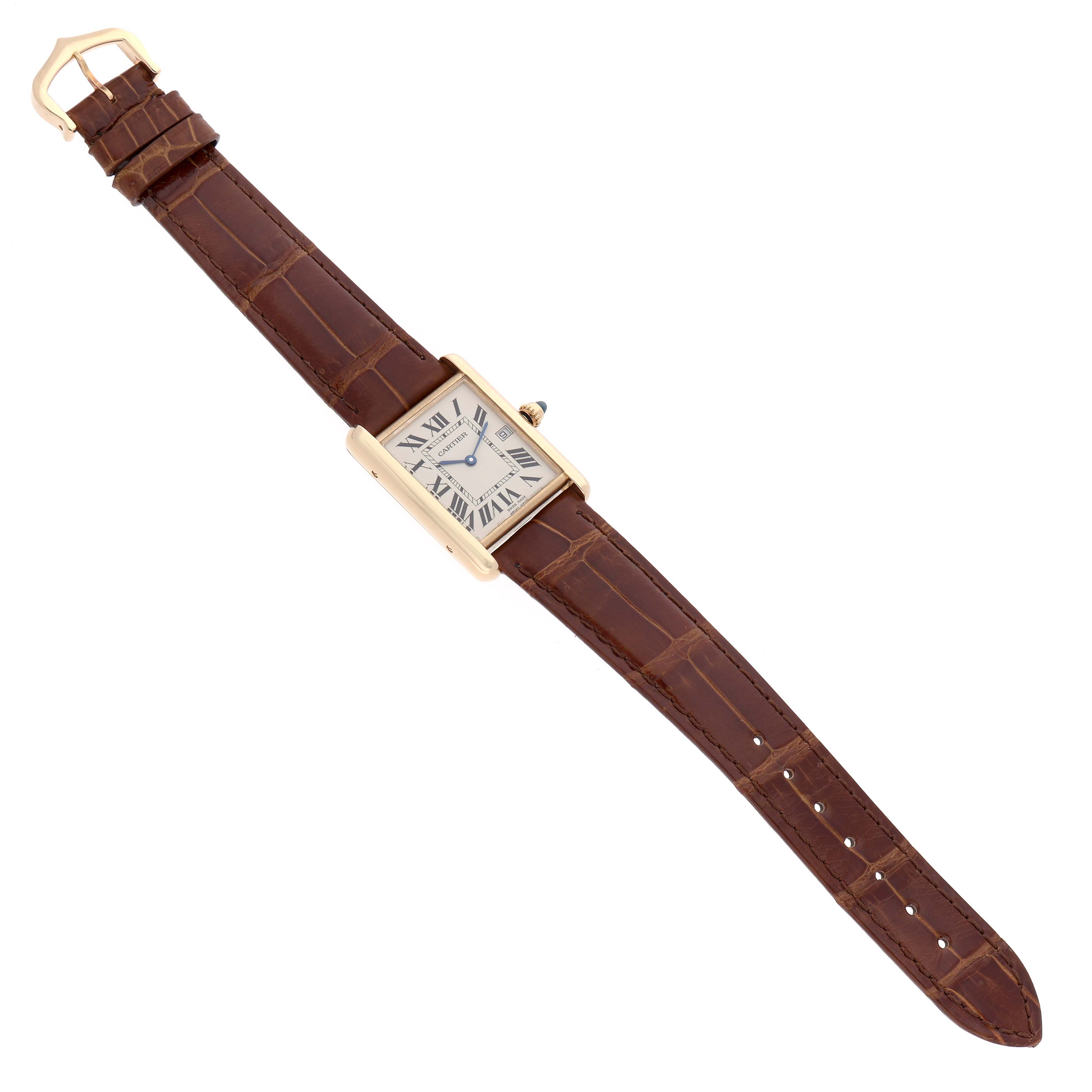 The Cartier Tank Louis W1529756 Men's Yellow Gold Silver Dial watch is shown at an oblique angle, displaying its rectangular case, dial, crown, and brown leather strap.