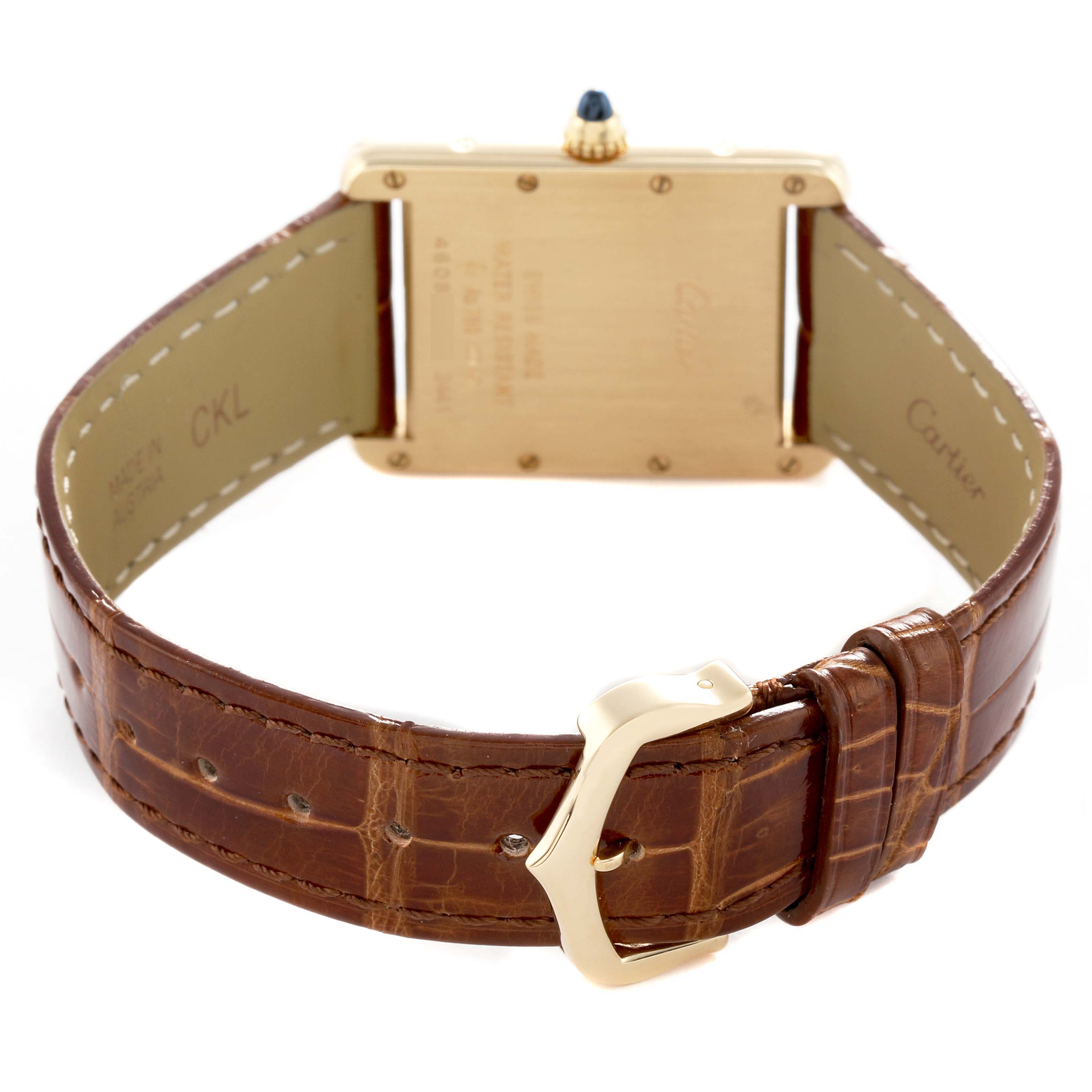 The Cartier Tank Louis W1529756 Men's Yellow Gold Silver Dial watch is shown from the back, highlighting the case back, leather strap, and buckle.