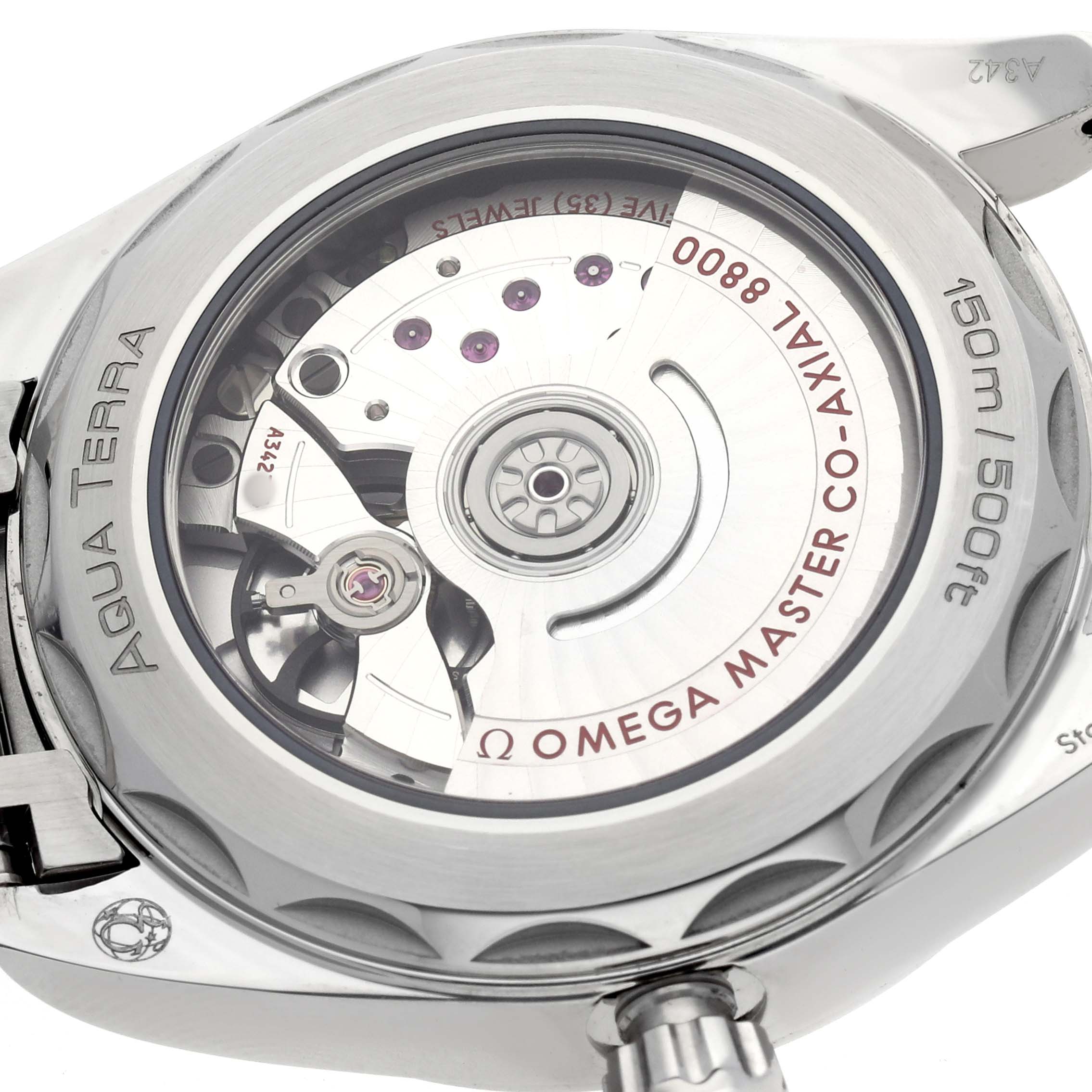 The image shows the case back of the Omega Aqua Terra 220.10.38.20.10.002 Men's Stainless Steel Green Dial watch, highlighting its automatic movement and detailed engravings.