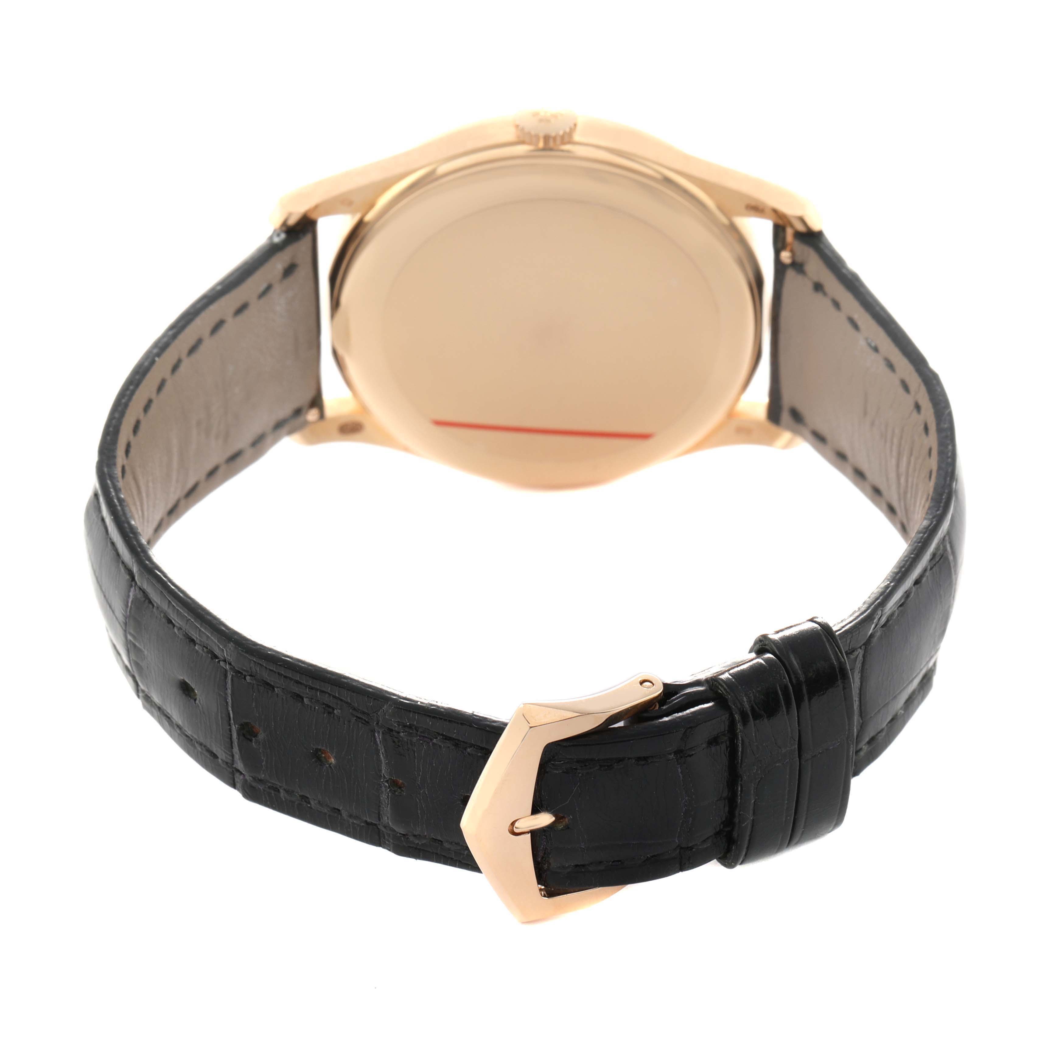 The Patek Philippe Calatrava 5196R Men's Rose Gold Grey Dial watch is shown from the back, highlighting the case, clasp, and black leather strap.