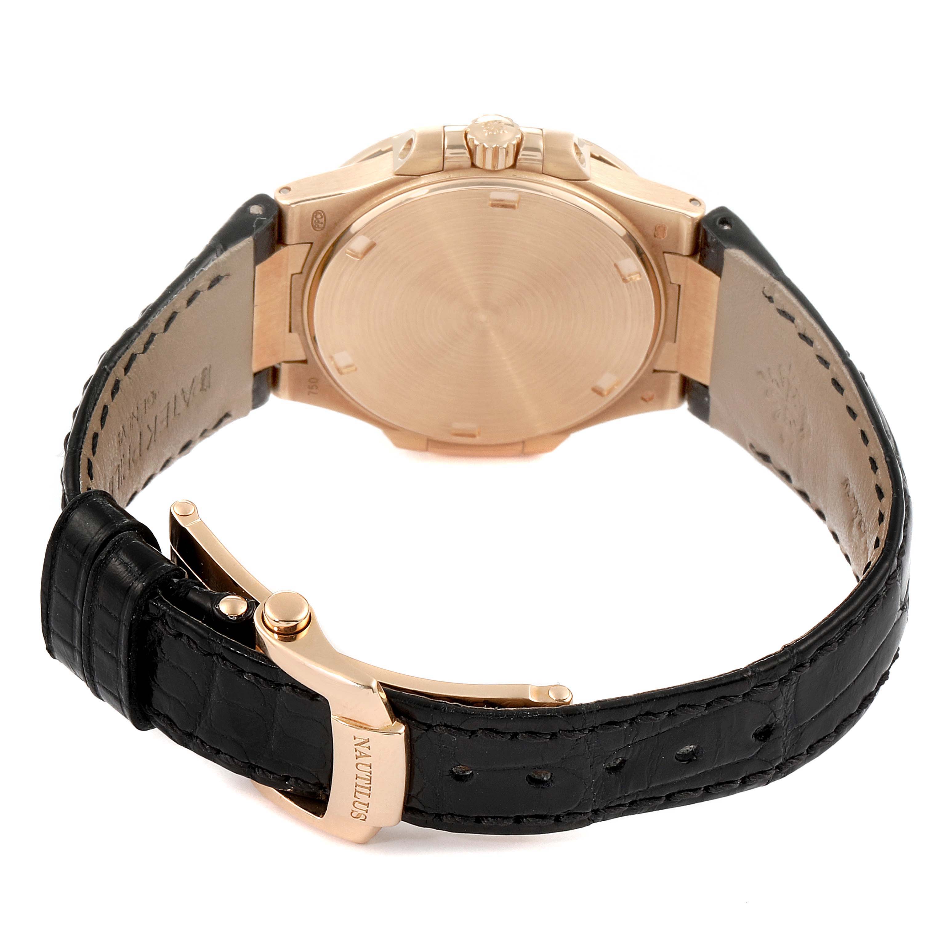 The image shows the back view of a Patek Philippe Nautilus 7010R Women's Rose Gold Silver Dial 7010R Women's Rose Gold Silver Dial watch with a leather strap and clasp visible.