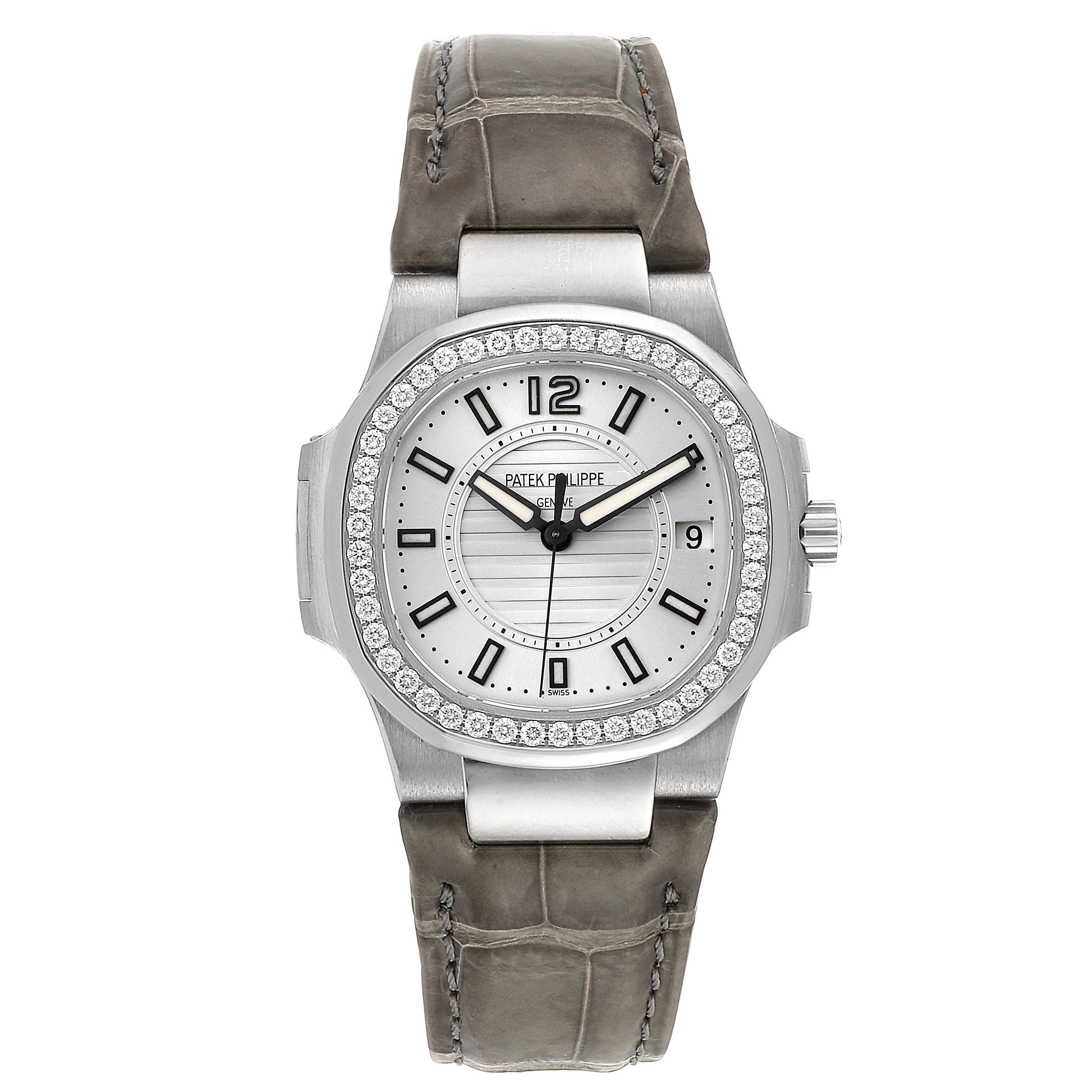 The image shows a front view of a Patek Philippe Nautilus 7010G Women's Yellow Gold Silver Dial 7010G Women's Yellow Gold Silver Dial watch with a grey leather strap and diamond-set bezel.