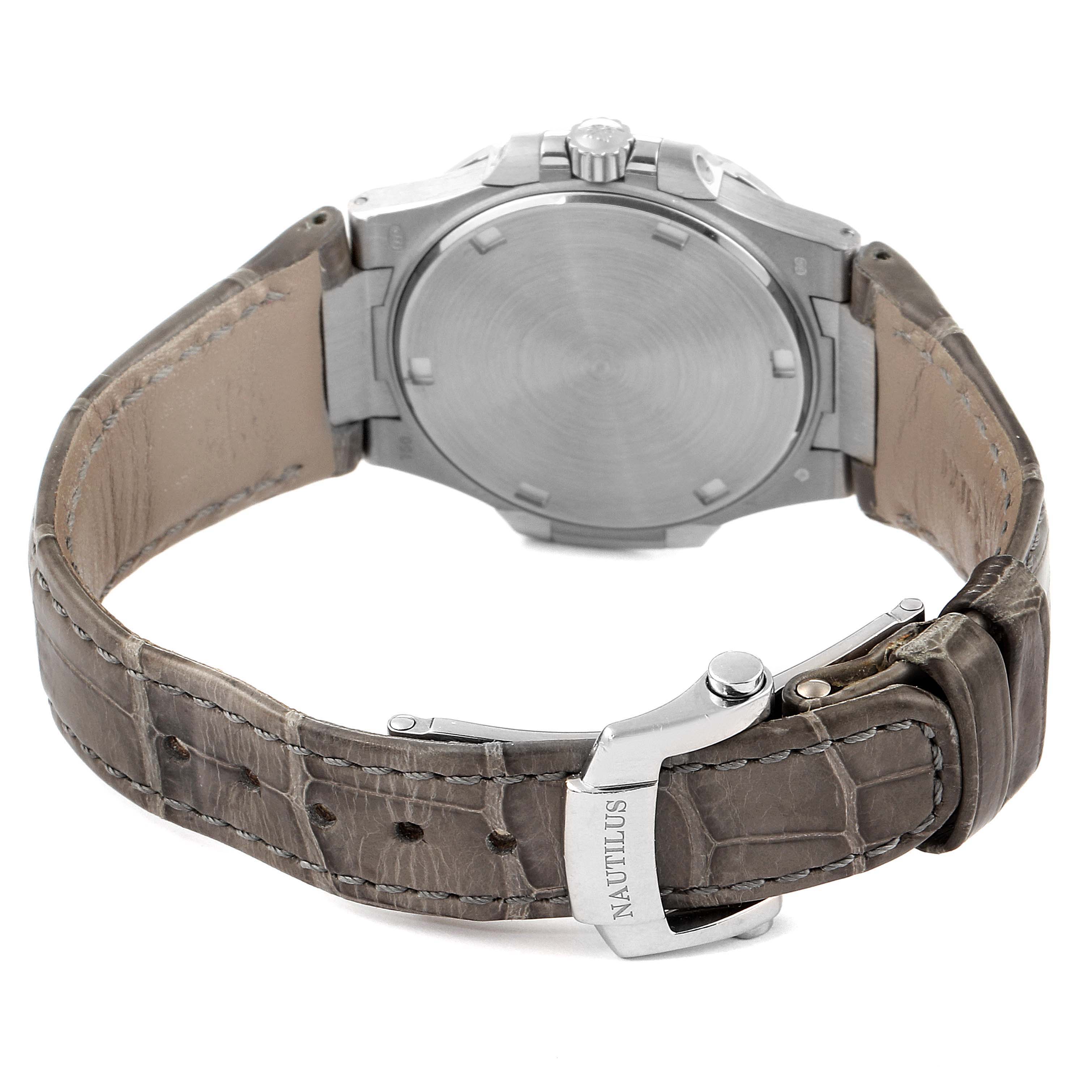 The image shows the back case and leather strap of a Patek Philippe Nautilus 7010G Women's Yellow Gold Silver Dial 7010G Women's Yellow Gold Silver Dial watch.