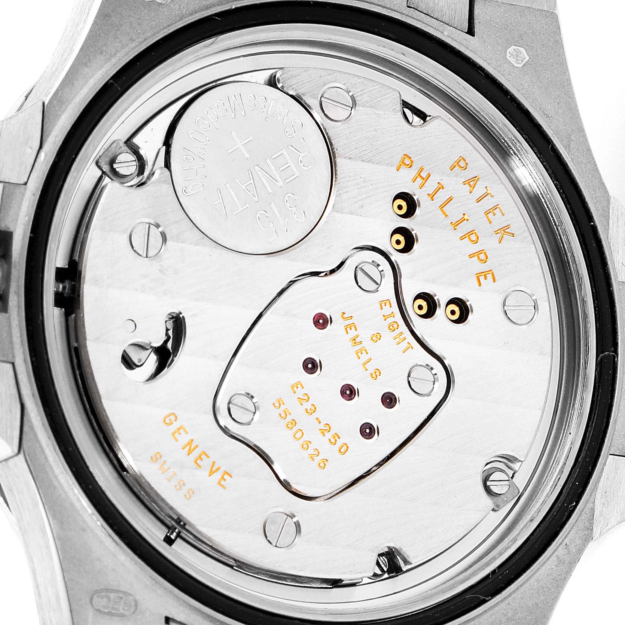 This image shows the back of a Patek Philippe Nautilus 7010G Women's Yellow Gold Silver Dial 7010G Women's Yellow Gold Silver Dial watch, revealing its internal movement and engravings.