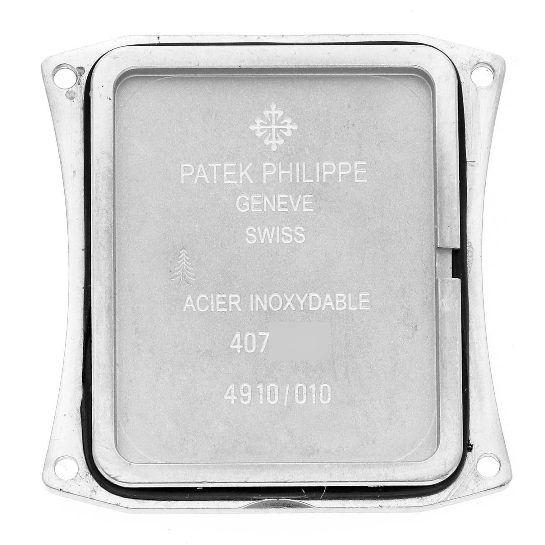 This image shows the back plate of a Patek Philippe Twenty-4 4910/10 Women's White Gold Blue Dial 4910/10 Women's White Gold Blue Dial watch, featuring engraved details.