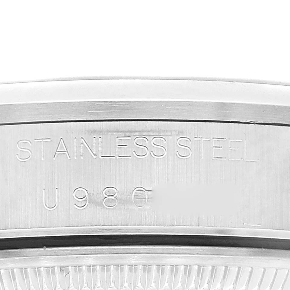 This close-up image of the Rolex Air-King 14000 Men's Stainless Steel Blue Dial 14000 Men's Stainless Steel Blue Dial watch shows the stainless steel engraving on the case back.