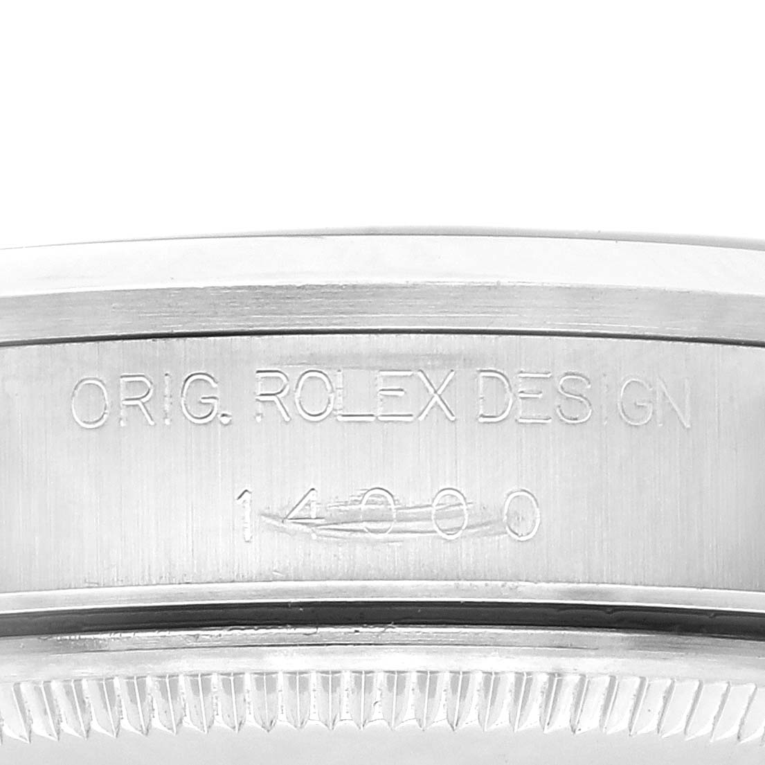 This image shows a close-up side view of the bezel and case of a Rolex Air-King 14000 Men's Stainless Steel Blue Dial 14000 Men's Stainless Steel Blue Dial watch, highlighting its engraved design and serial number.