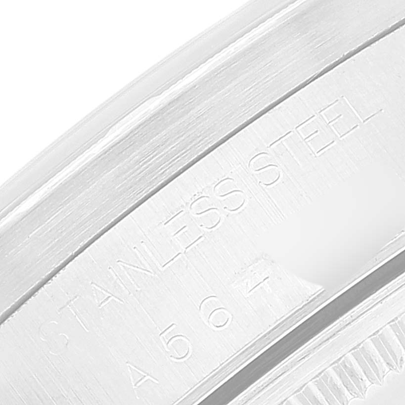 This close-up image shows the "STAINLESS STEEL" engraving and partial serial number on a Rolex Air-King 14010 Men's Stainless Steel Blue Dial 14010 Men's Stainless Steel Blue Dial watch case.