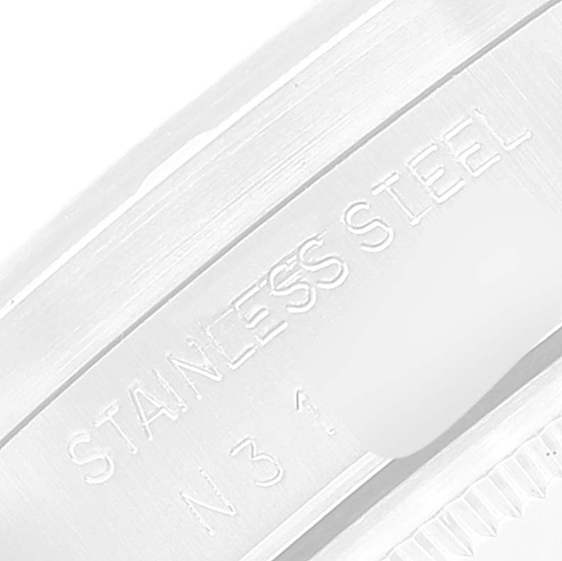 The image shows a close-up angle of the back casing of a Rolex Air-King 14010 Men's Stainless Steel Blue Dial 14010 Men's Stainless Steel Blue Dial watch, highlighting the "STAINLESS STEEL" engraving.