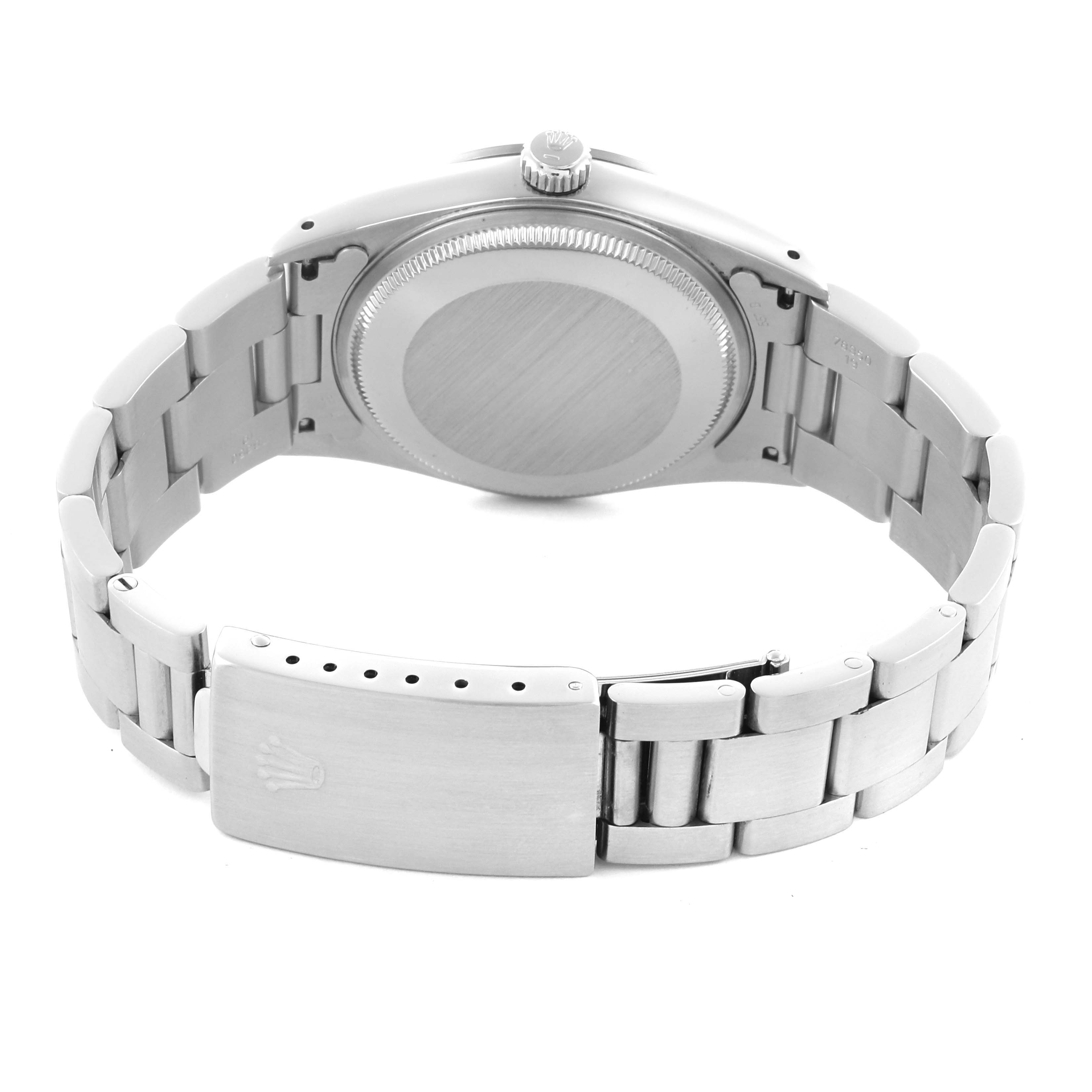 The Rolex Air-King 14000 Men's Stainless Steel Blue Dial 14000 Men's Stainless Steel Blue Dial watch is shown from the back, highlighting its case back and clasp.