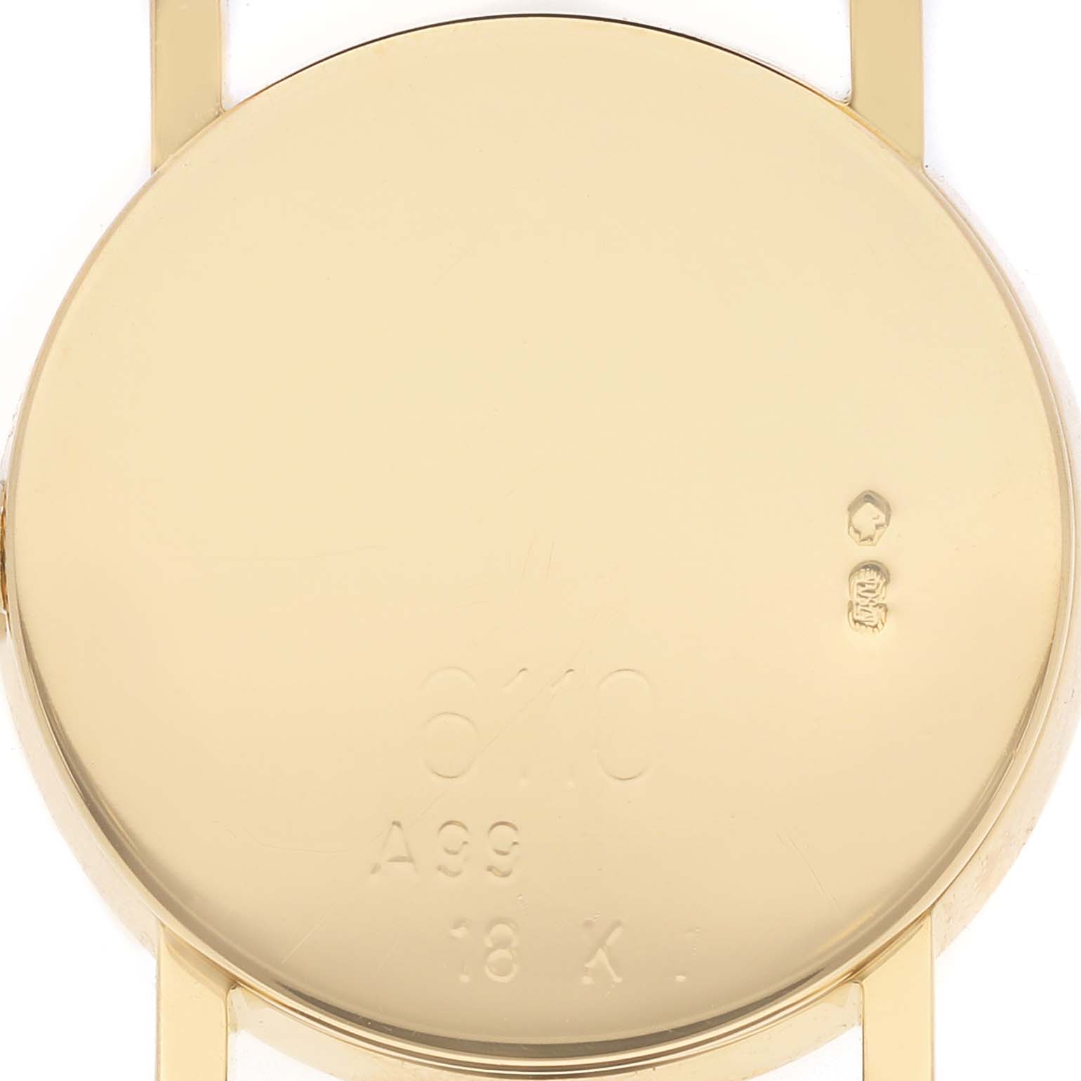 The image shows the back case of a Rolex Cellini 6110 Women's Yellow Gold Mother of Pearl Dial watch, highlighting its markings and engravings.