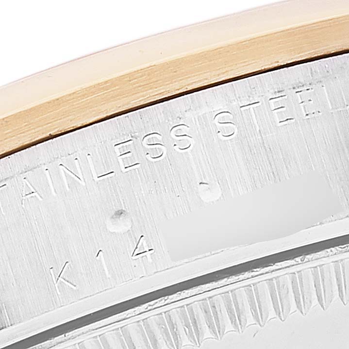 This image shows a close-up view of the bezel and engraved markings on a Rolex Mid-Size 78243 Women's Steel and Gold (two tone) Grey Dial 78243 Women's Steel and Gold (two tone) Grey Dial watch.