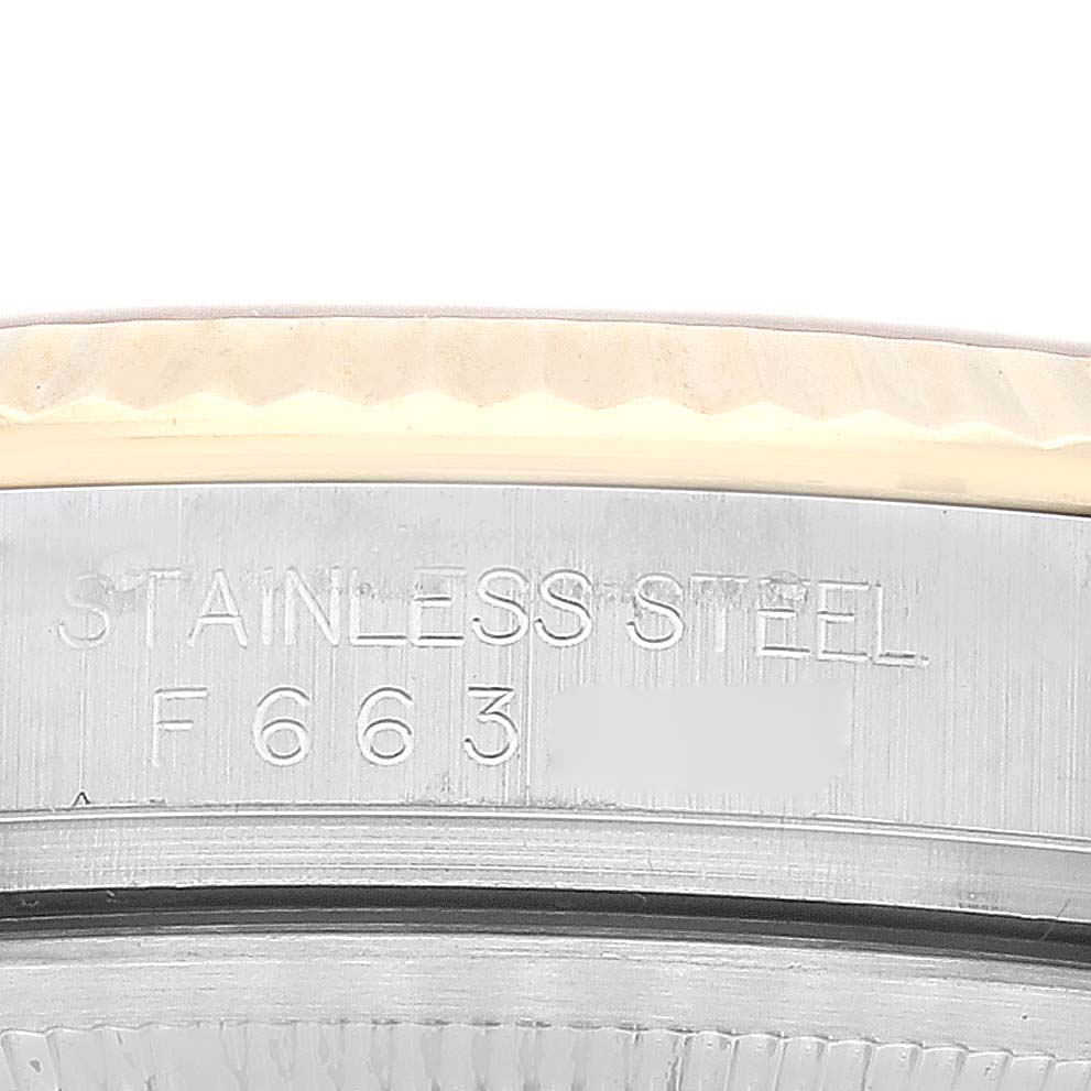 This image shows the stainless steel case back with the engraved model number of a Rolex Datejust 116233 Men's Steel and Gold (two tone) Champagne Dial 116233 Men's Steel and Gold (two tone) Champagne Dial watch.
