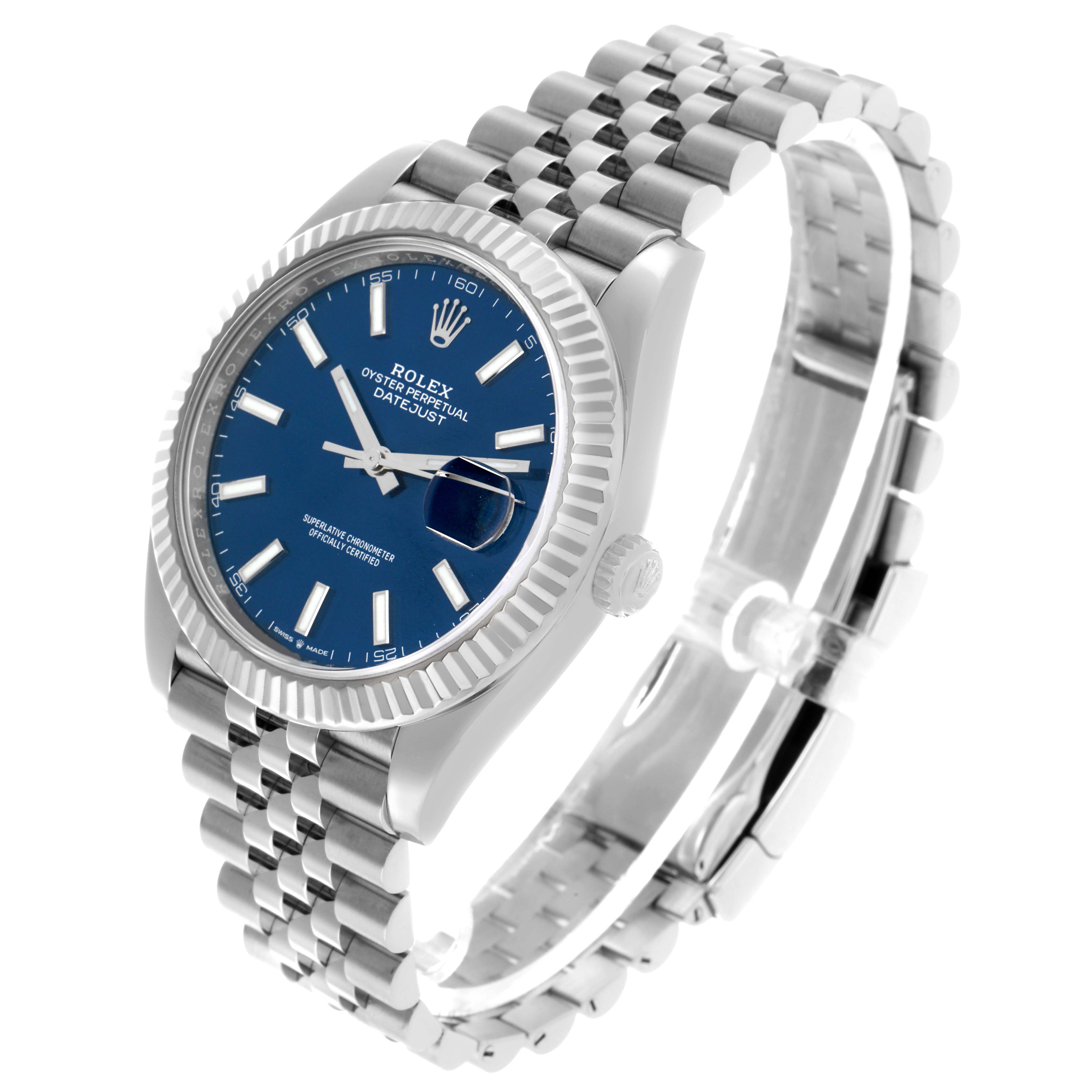 The Rolex Datejust 41 126334 Men's Stainless Steel Blue Dial is shown at a three-quarter angle, highlighting the blue dial, fluted bezel, and Jubilee bracelet.