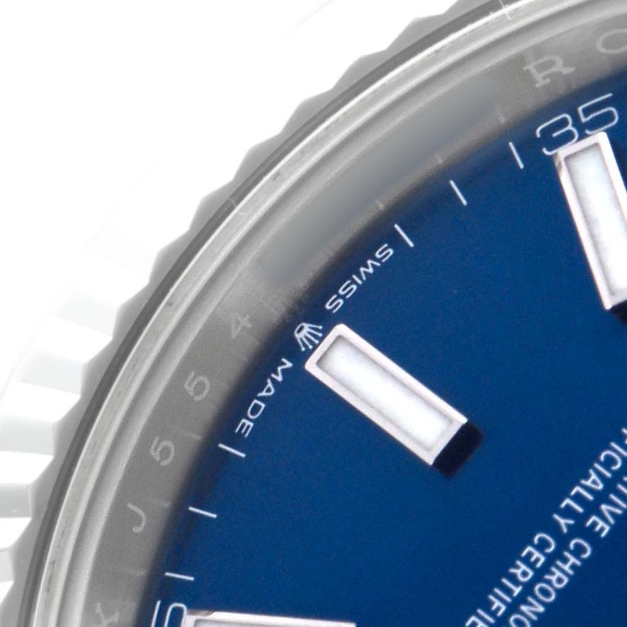 The image shows a close-up of the blue dial and part of the bezel of a Rolex Datejust 41 126334 Men's Stainless Steel Blue Dial watch.
