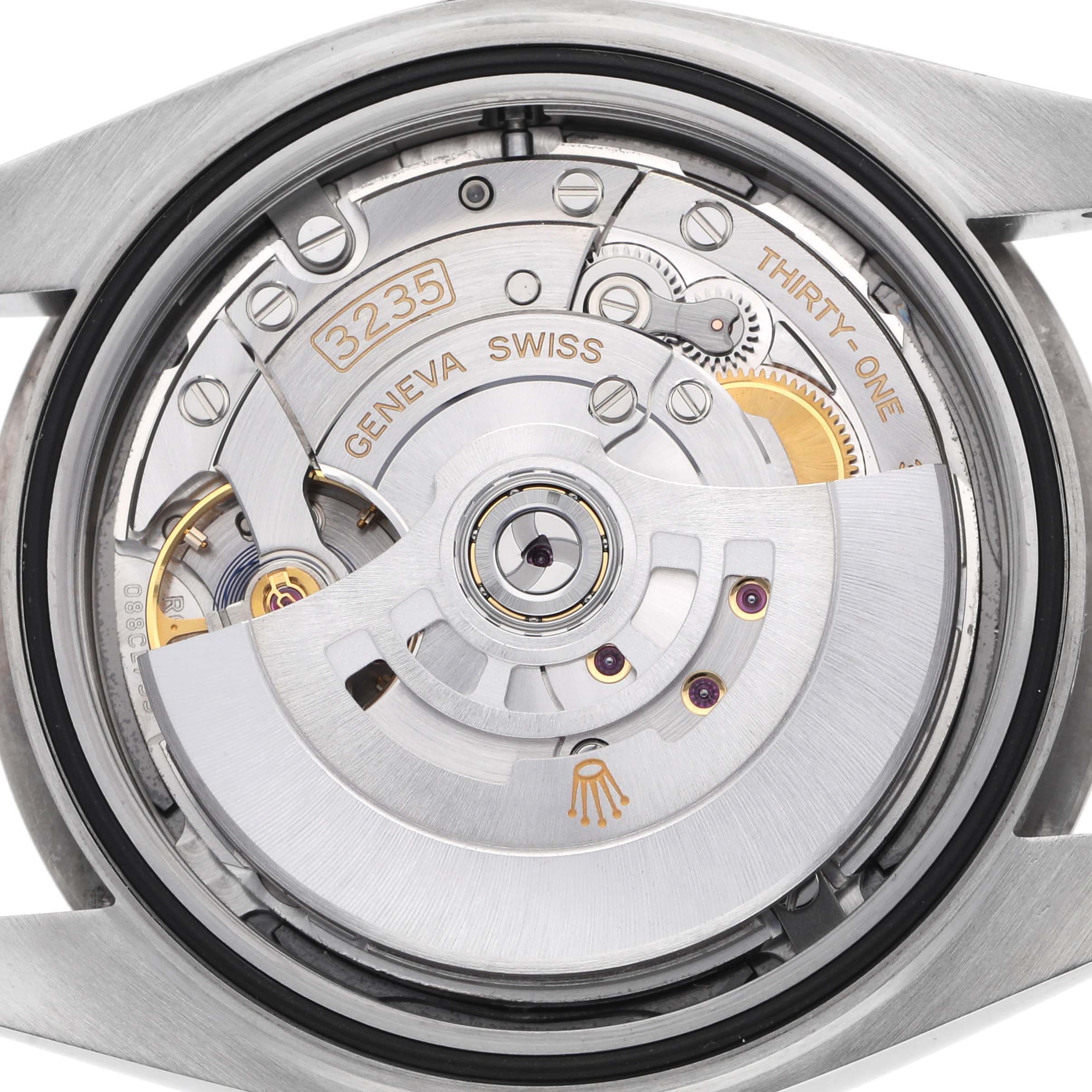 The image shows the back view of a Rolex Datejust 41 126334 Men's Stainless Steel Blue Dial, featuring its movement and rotor.