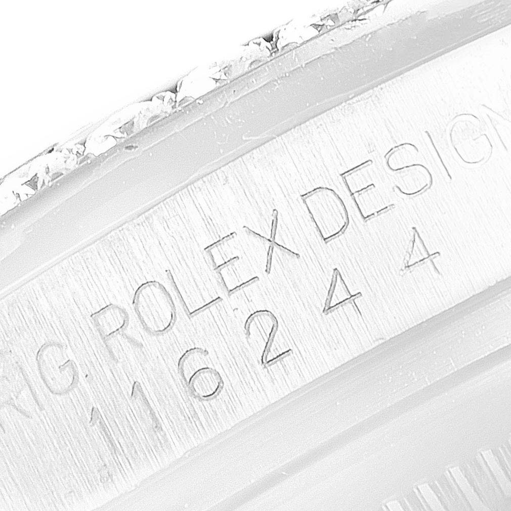 The image shows a close-up of the engraved part of the bezel and case of a Rolex Datejust 116244 Men's Stainless Steel Mother of Pearl Dial 116244 Men's Stainless Steel Mother of Pearl Dial watch.
