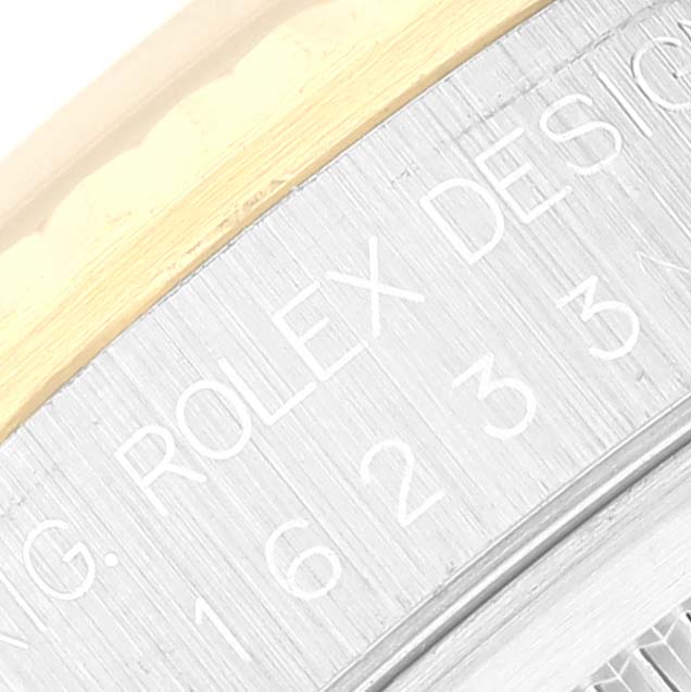 This image shows a close-up of the engraved inner bezel of a Rolex Datejust 16233 Men's Steel and Gold (two tone) Champagne Dial 16233 Men's Steel and Gold (two tone) Champagne Dial watch.