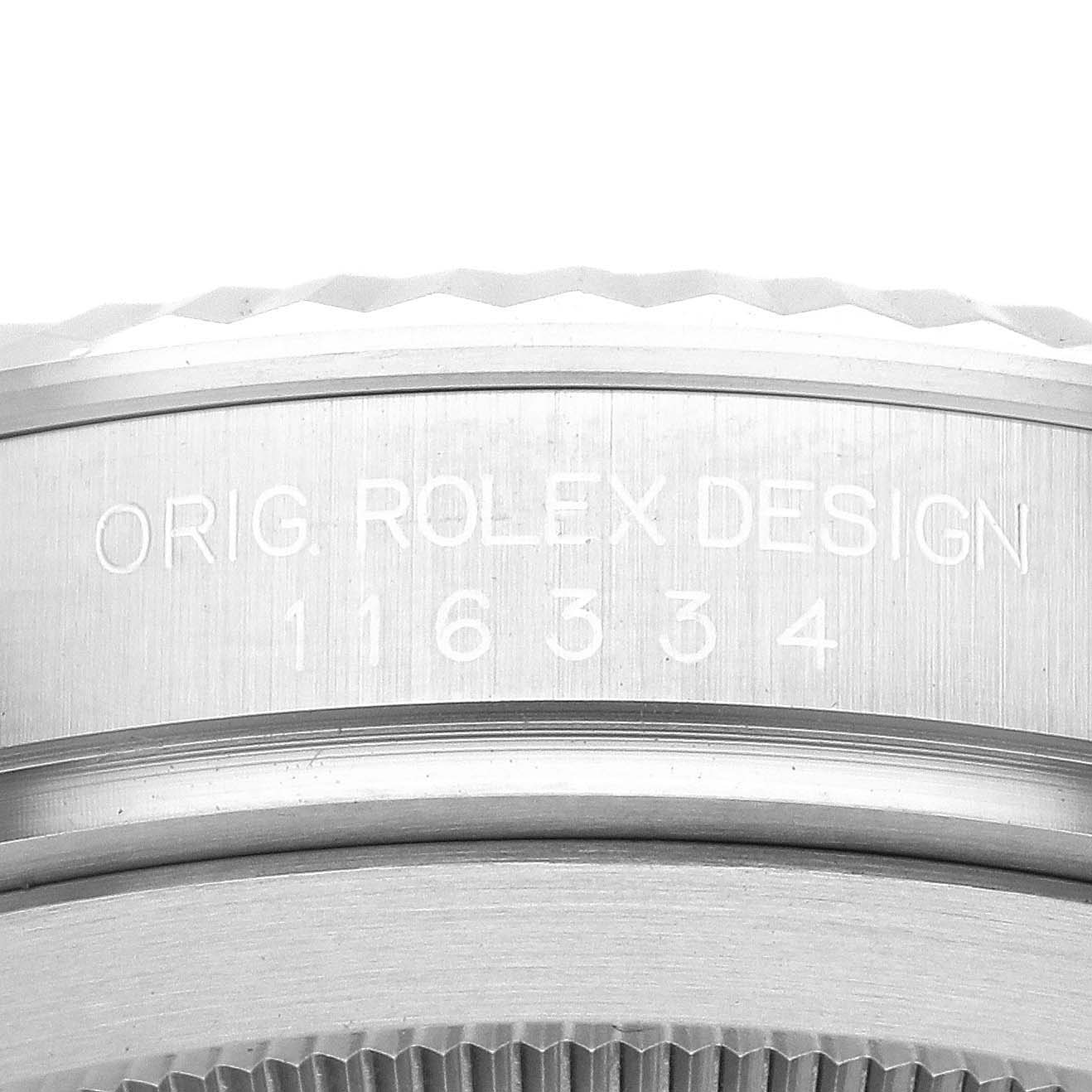 The image shows a close-up of the case side, engraving, and bezel of a Rolex Datejust 41 116334 Men
s Stainless Steel Black Dial 116334 Men
s Stainless Steel Black Dial watch.