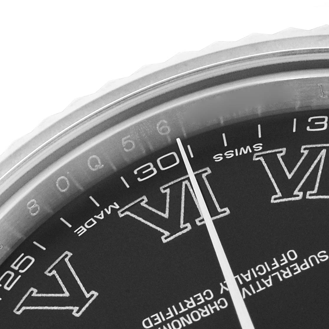 The image shows a close-up of the Rolex Datejust 41 116334 Men
s Stainless Steel Black Dial 116334 Men
s Stainless Steel Black Dial, highlighting the dial and Roman numerals.