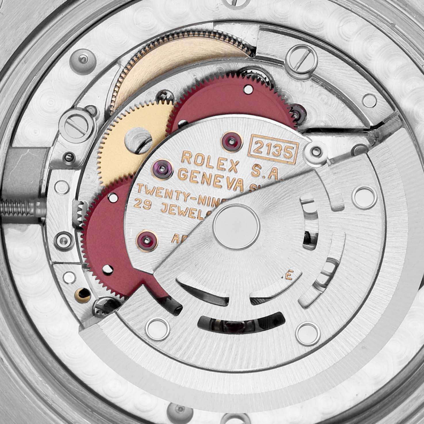 The image shows a close-up view of the Rolex Mid-Size 68273 Women's Steel and Gold (two tone) Silver Dial 68273 Women's Steel and Gold (two tone) Silver Dial model's movement, featuring gears and the rotor mechanism.