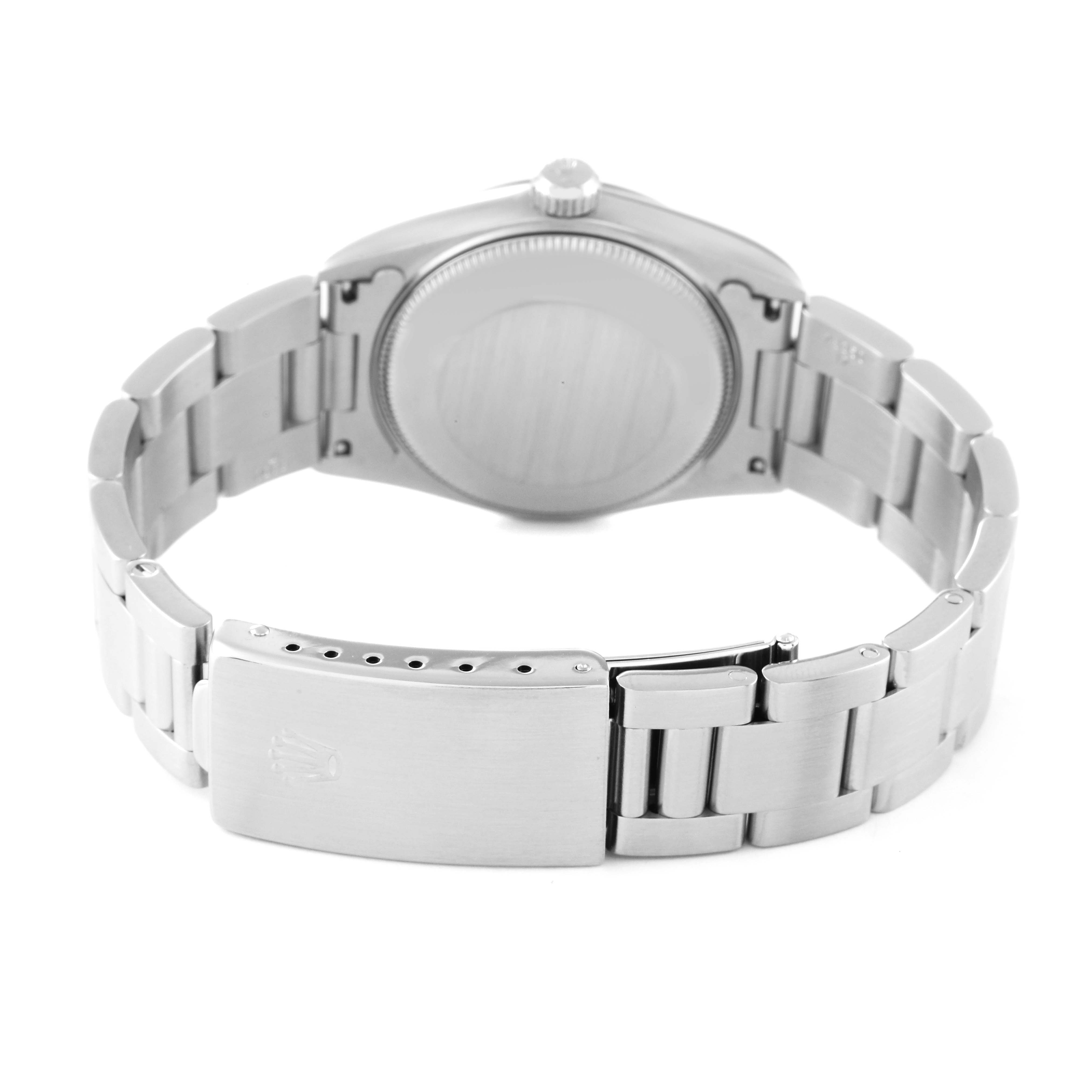 The image shows the backside and bracelet of a Mid-Size Rolex watch, with the clasp and case back visible.