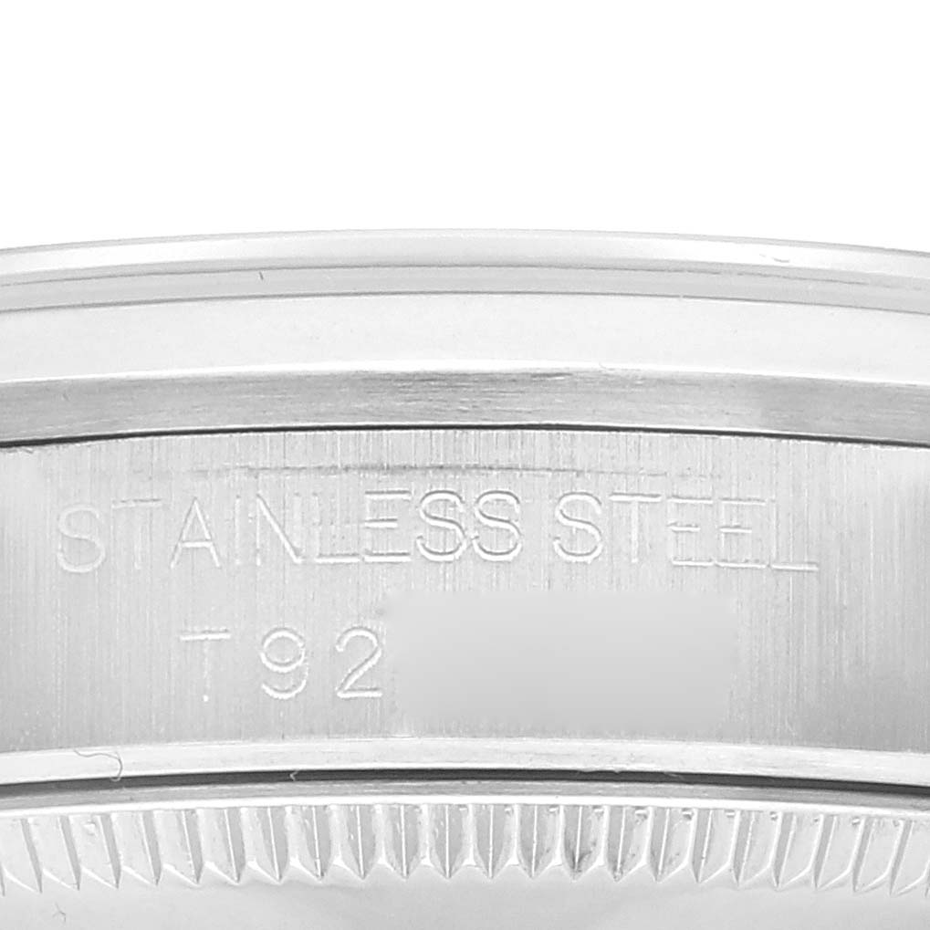 The image shows a close-up of the side engraving on a stainless steel Rolex Mid-Size 68240 Women
s Stainless Steel Silver Dial 68240 Women
s Stainless Steel Silver Dial model.