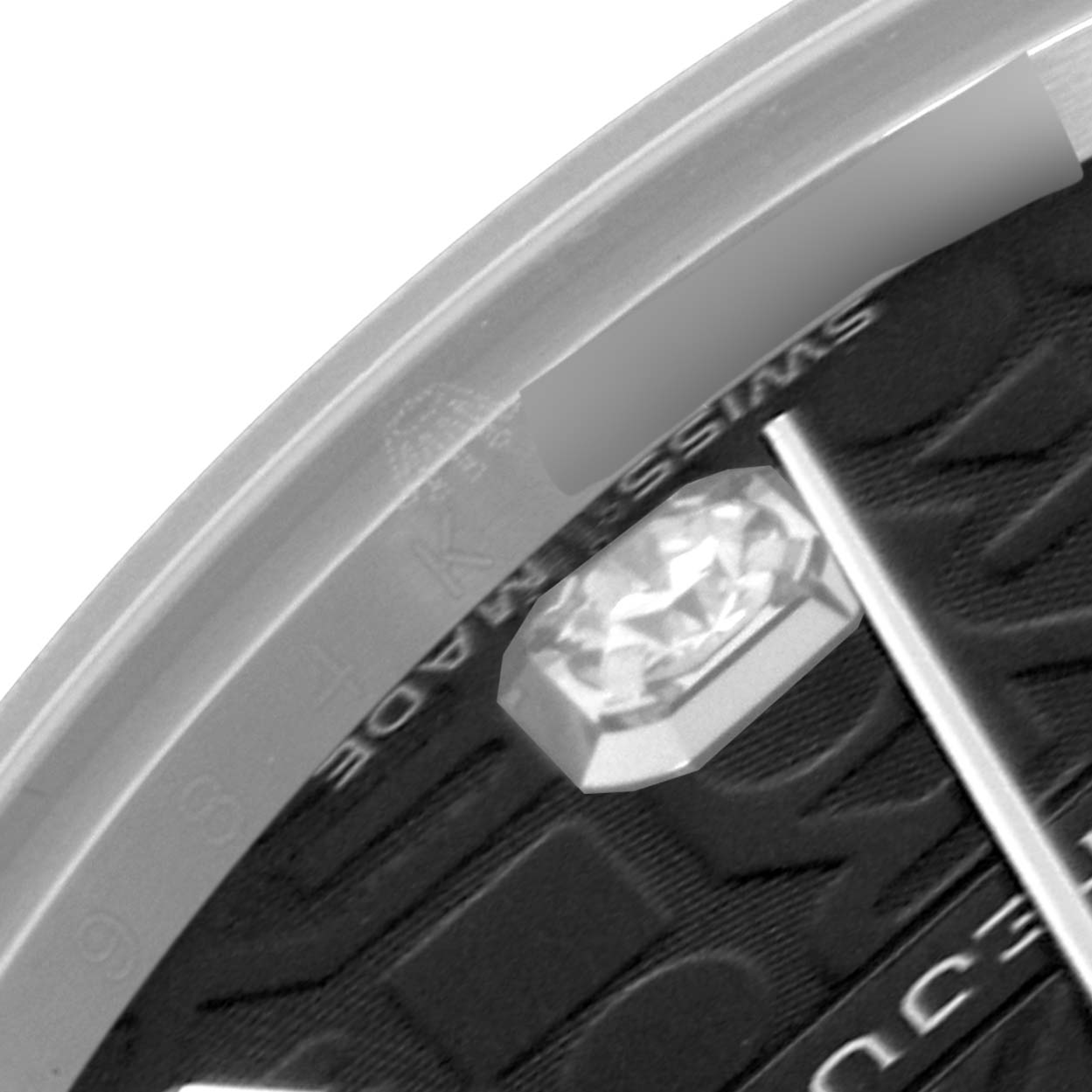 The image shows a close-up of the dial edge and a diamond marker on a Rolex Mid-Size 178274 Women's Stainless Steel Black Dial 178274 Women's Stainless Steel Black Dial watch.