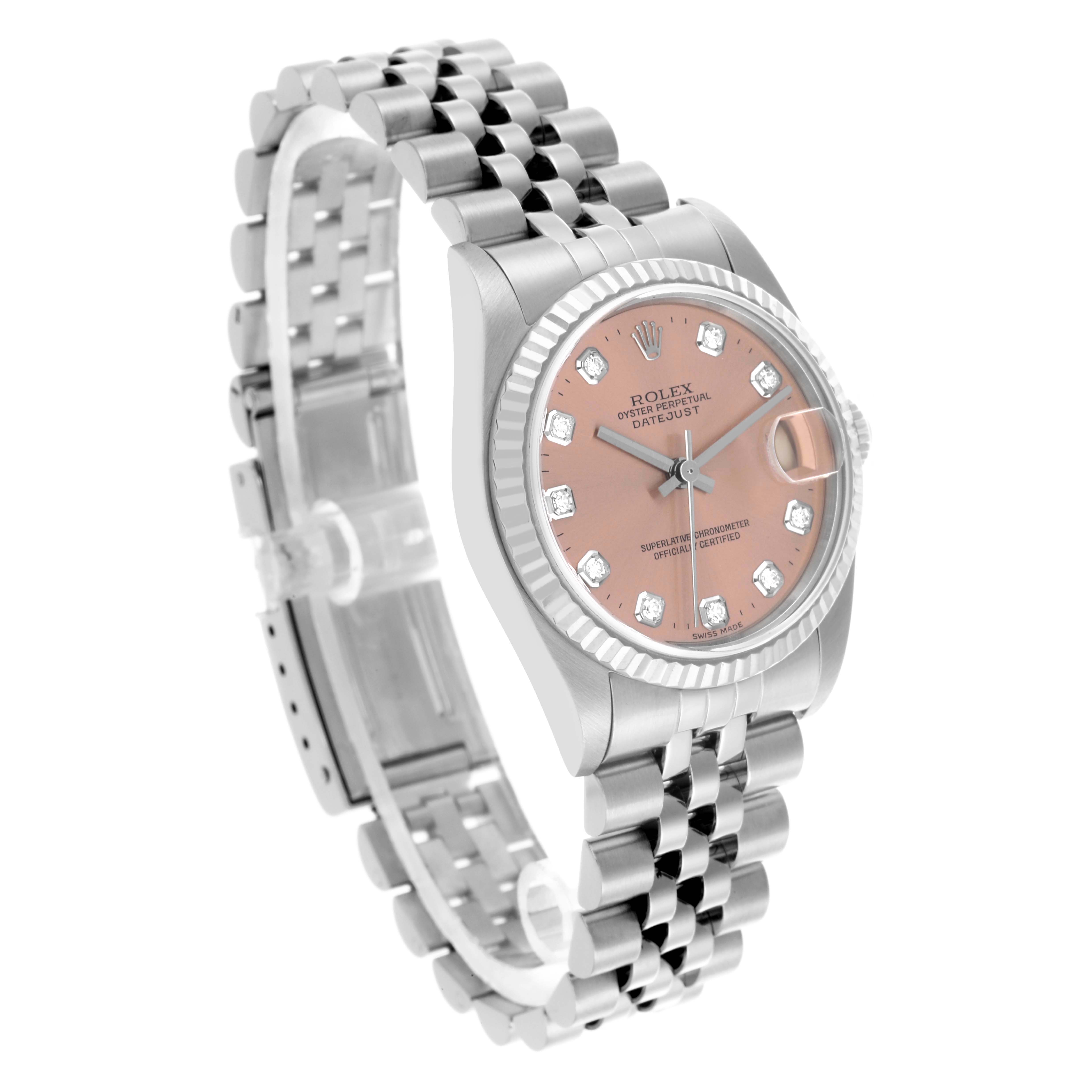 The Rolex Mid-Size 78274 Women's Stainless Steel Pink Dial 78274 Women's Stainless Steel Pink Dial watch is shown from a three-quarter angle, displaying the face, bezel, and partially open bracelet.