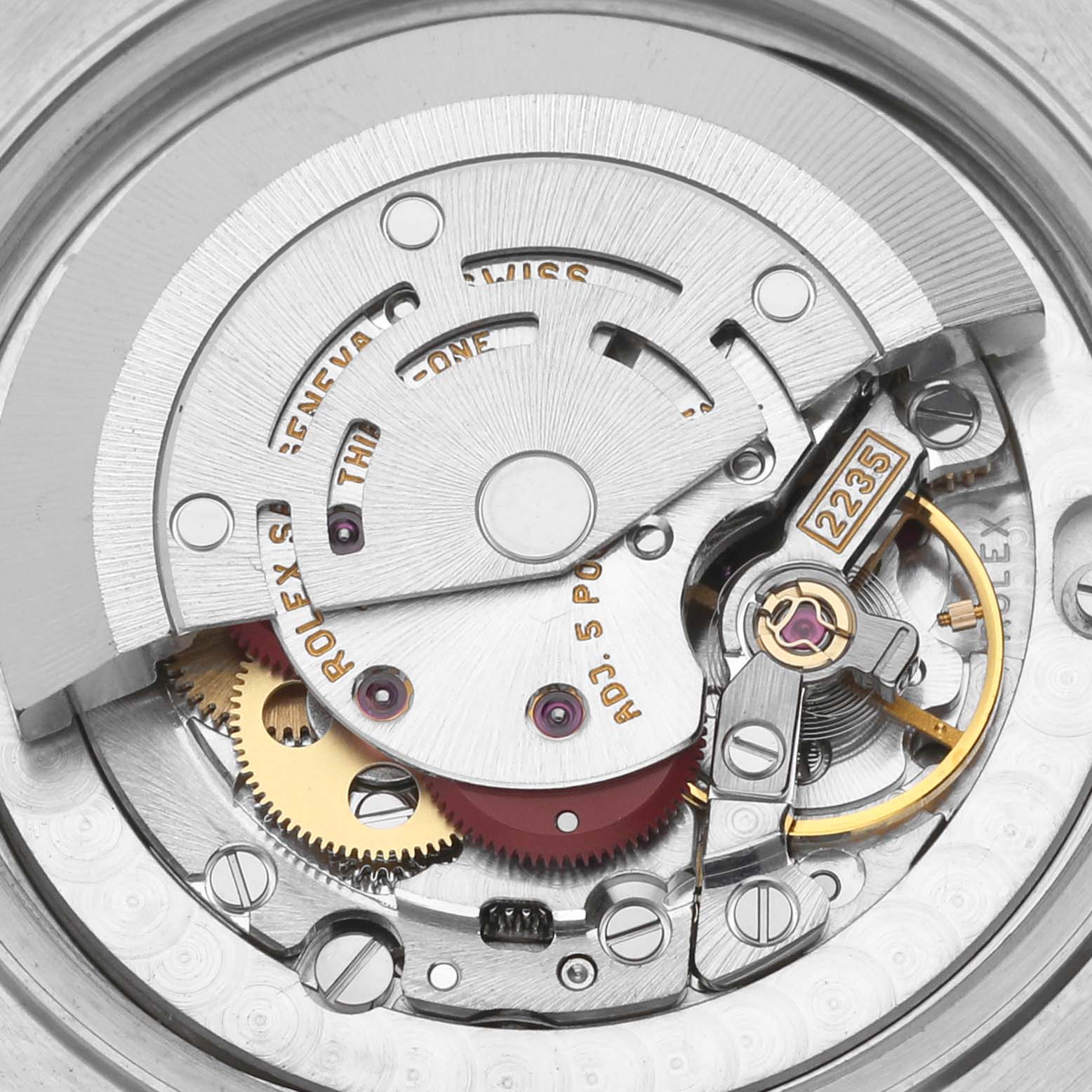 The image shows a close-up of the Rolex Datejust 78274 Women's Stainless Steel Silver Dial 78274 Women's Stainless Steel Silver Dial movement, highlighting gears and the rotor from a top-down angle.