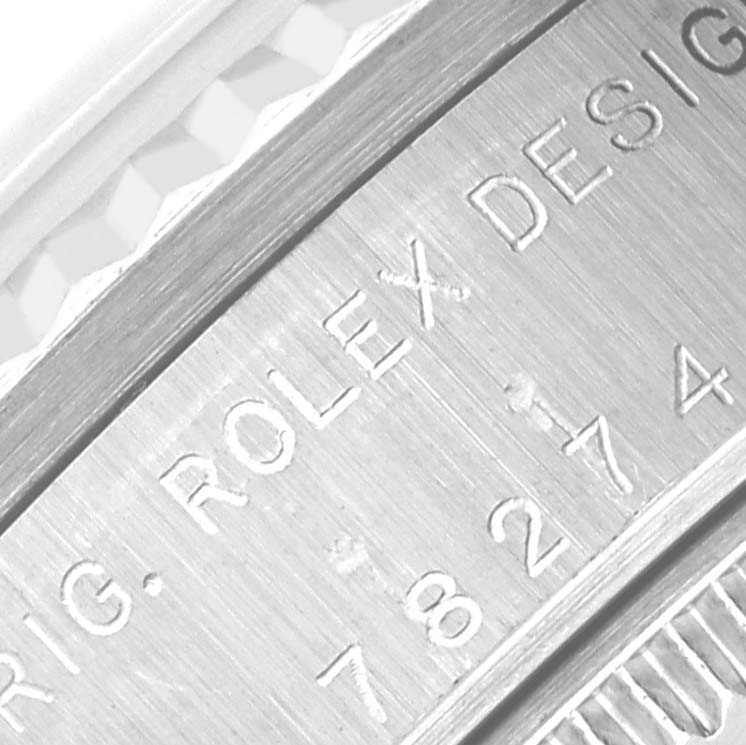 The image shows an engraved side view of a Rolex Datejust 78274 Women's Stainless Steel Silver Dial 78274 Women's Stainless Steel Silver Dial watch, highlighting the "ROLEX DESIGN" inscription and serial number.