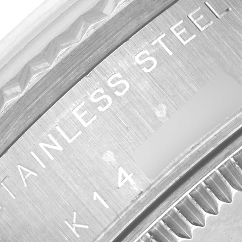 This image shows a close-up of the stainless steel part of a Rolex Datejust 78274 Women's Stainless Steel Silver Dial 78274 Women's Stainless Steel Silver Dial watch, focusing on the edge and engravings.