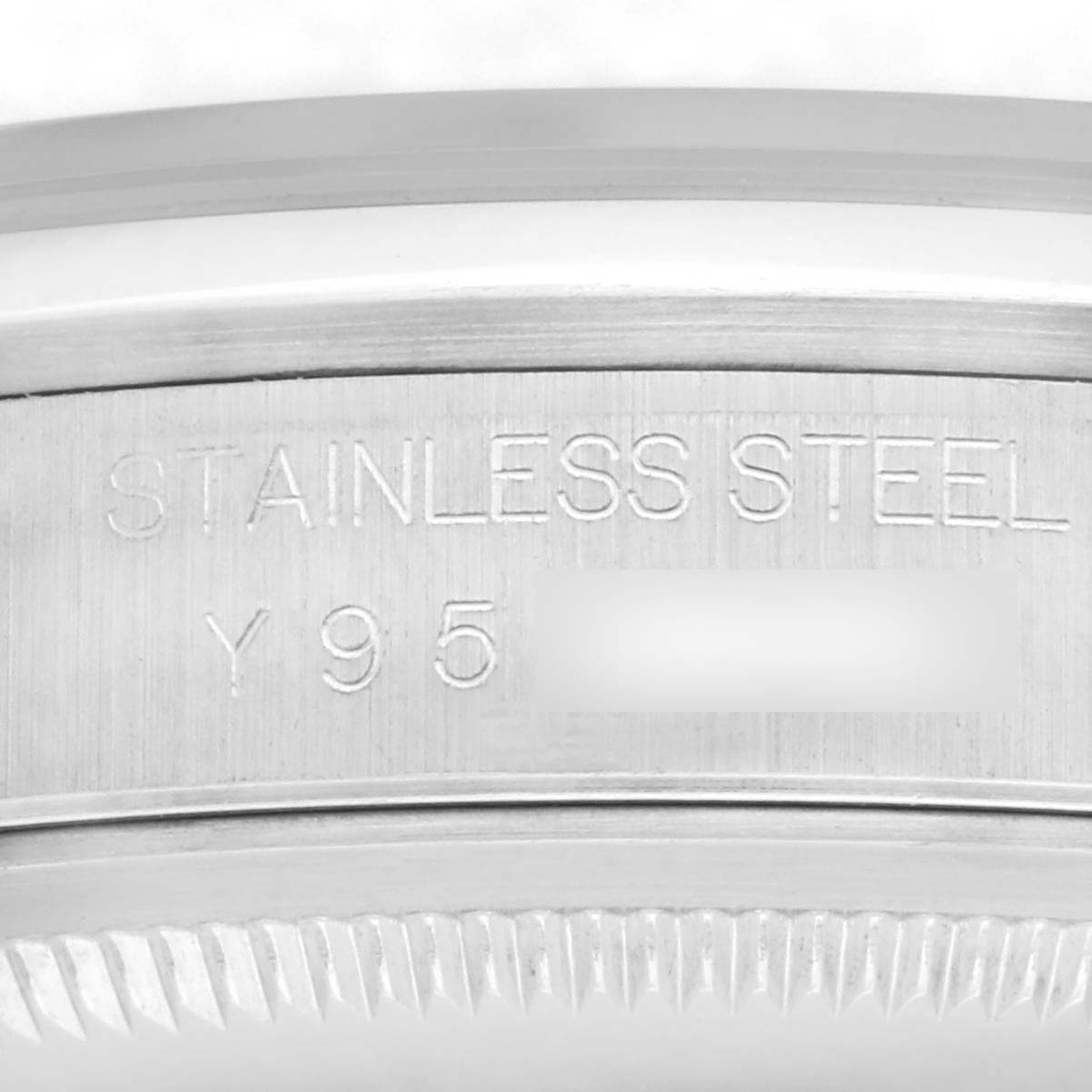 The image shows a close-up of the case back edge of a Rolex Datejust 16200 Men's Stainless Steel Silver Dial, displaying "STAINLESS STEEL" engraving.
