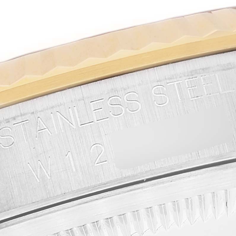 The image shows a close-up of the side edge of a Rolex Datejust 16233 Men's Steel and Gold (two tone) White Dial 16233 Men's Steel and Gold (two tone) White Dial watch, highlighting the stainless steel and part of the bezel.