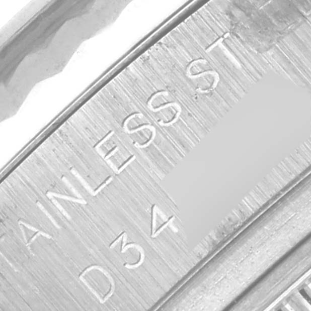 The image shows a close-up of the inner rim of a Rolex Datejust 179174 Women
s Stainless Steel Black Dial 179174 Women
s Stainless Steel Black Dial watch with "STAINLESS ST." engraved.