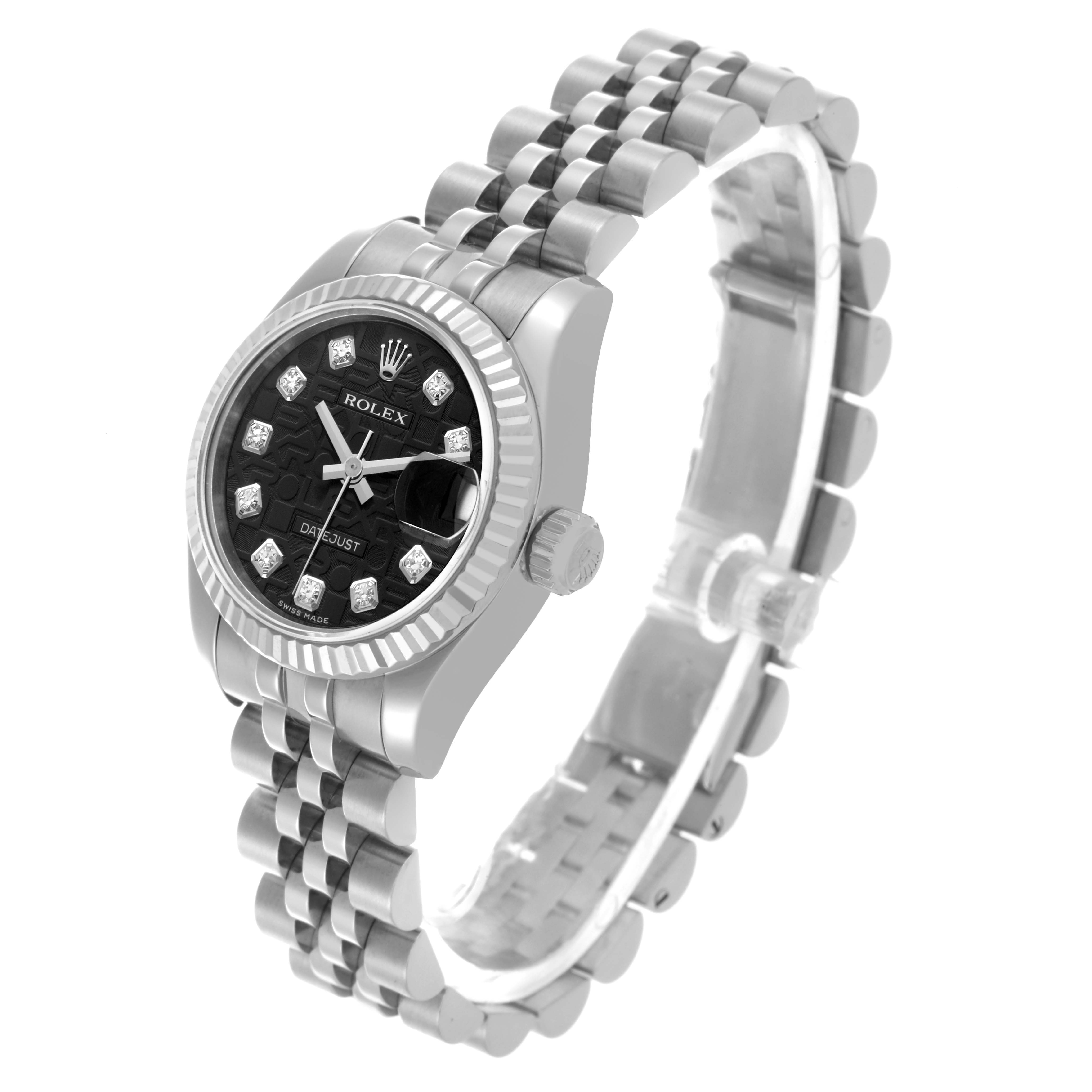The Rolex Datejust 179174 Women
s Stainless Steel Black Dial 179174 Women
s Stainless Steel Black Dial watch is shown at a three-quarter angle, highlighting the face, case, band, and fluted bezel.