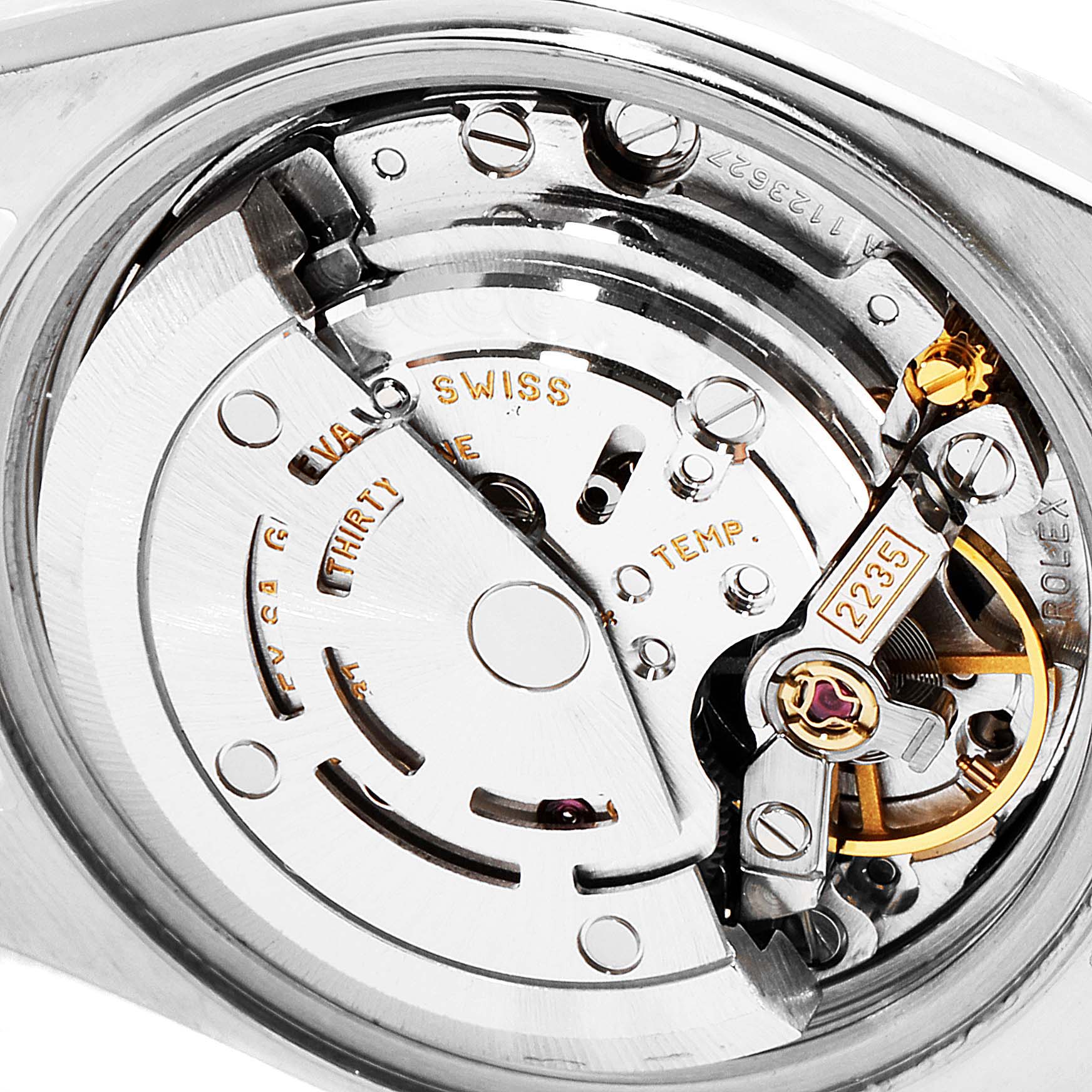 This image shows a close-up view of the movement mechanism of the Rolex Datejust 79174 Women
s Stainless Steel Pink Dial 79174 Women
s Stainless Steel Pink Dial watch.