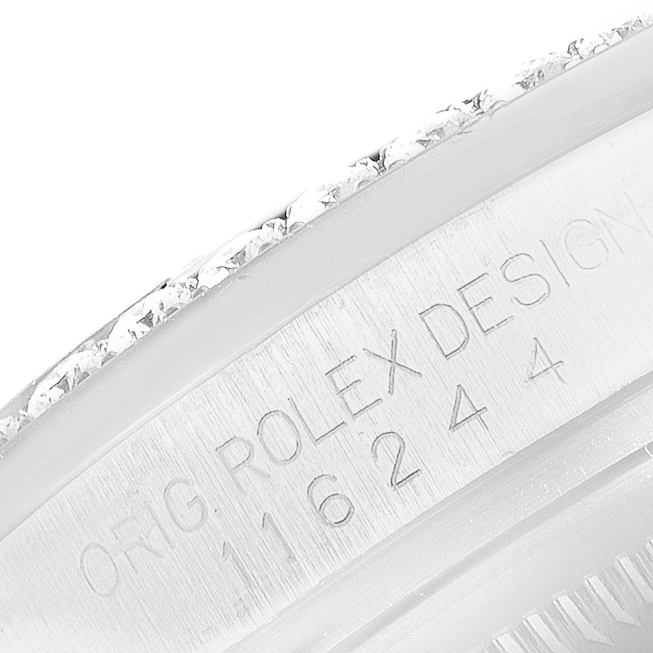 The image shows a close-up of the serial number engraving on the side of a Rolex Datejust 116244 Men's Stainless Steel Silver Dial watch case.