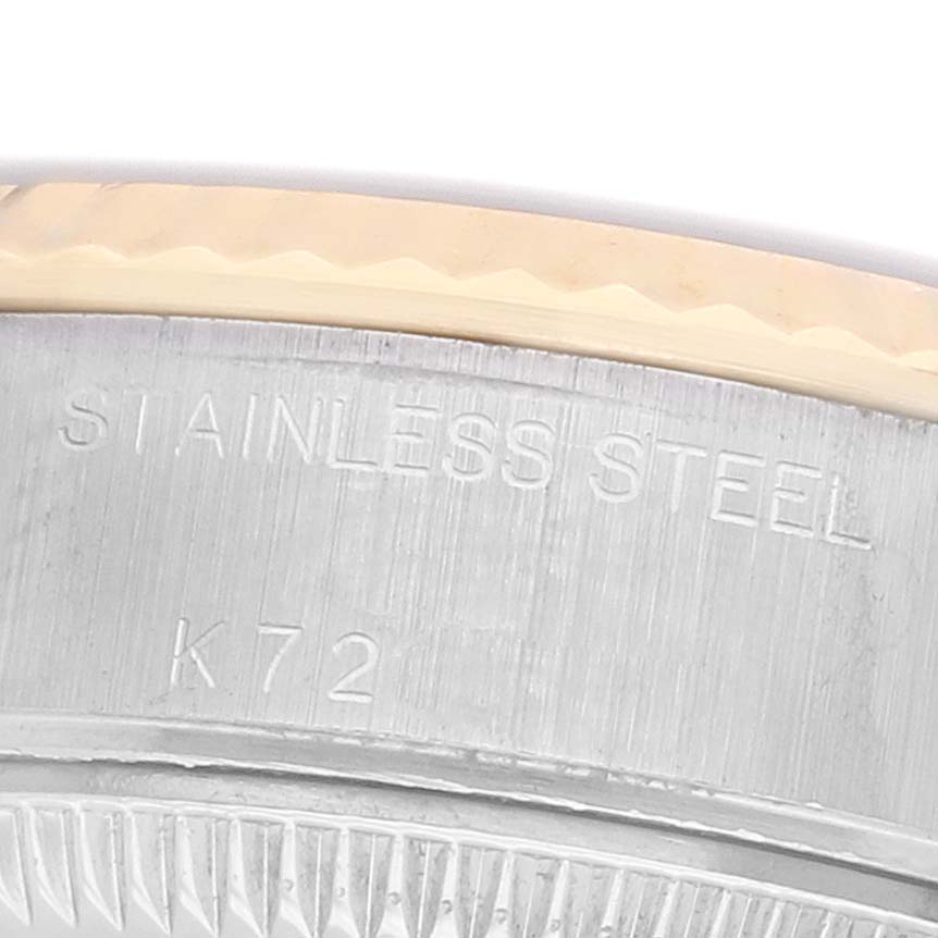 The image shows a close-up of the side of a Rolex Datejust 79173 Women's Steel and Gold (two tone) Blue Dial, featuring the edge of the stainless steel case and part of the bezel.