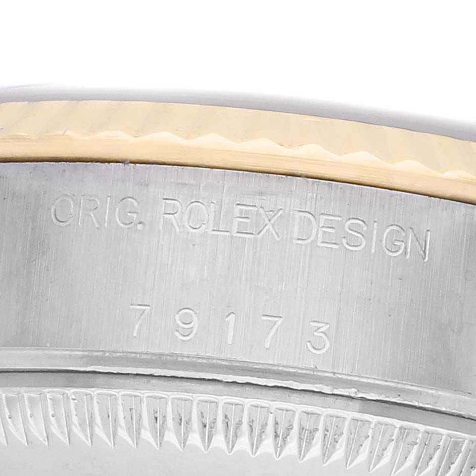 The image shows a close-up of the side of a Rolex Datejust 79173 Women's Steel and Gold (two tone) Blue Dial, highlighting the model number and edge of the bezel.