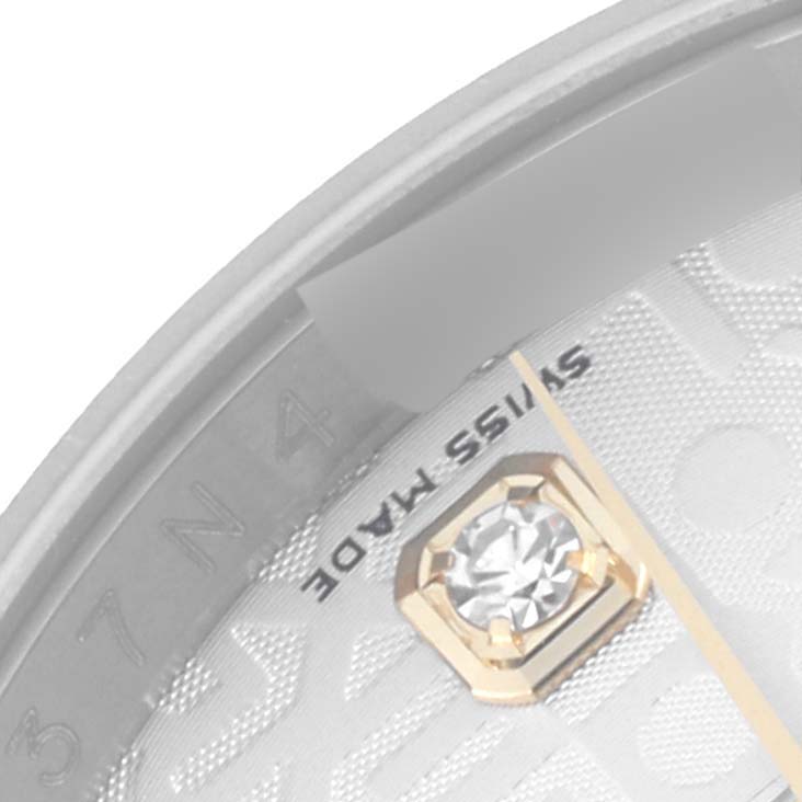 The close-up image shows part of the dial and indices of a Rolex Datejust 116233 Men's Steel and Gold (two tone) Silver Dial 116233 Men's Steel and Gold (two tone) Silver Dial watch, featuring a diamond marker.