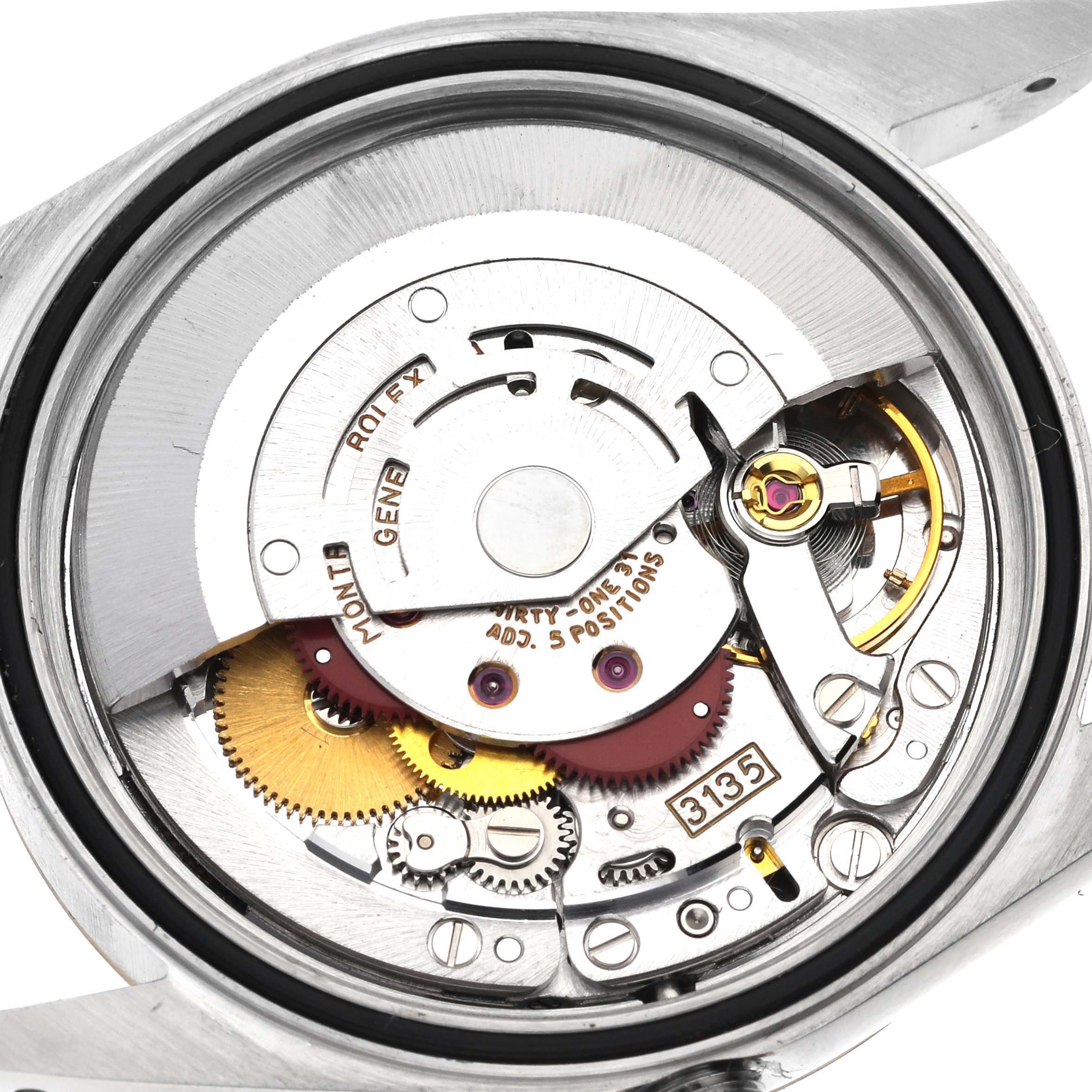 The image shows the movement mechanism of a Rolex Datejust 16233 Men
s Steel and Gold (two tone) Champagne Dial 16233 Men
s Steel and Gold (two tone) Champagne Dial, viewed from the back, detailing gears and components.