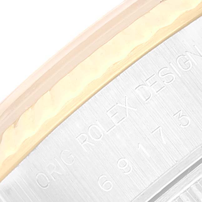 The image shows a close-up view of the side of the bezel and the case back of the Rolex Datejust 69173 Women's Steel and Gold (two tone) Champagne Dial 69173 Women's Steel and Gold (two tone) Champagne Dial model.