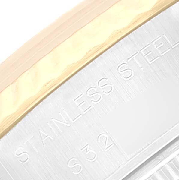 This close-up shows the side of the Rolex Datejust 69173 Women's Steel and Gold (two tone) Champagne Dial 69173 Women's Steel and Gold (two tone) Champagne Dial watch case, highlighting the stainless steel inscription.