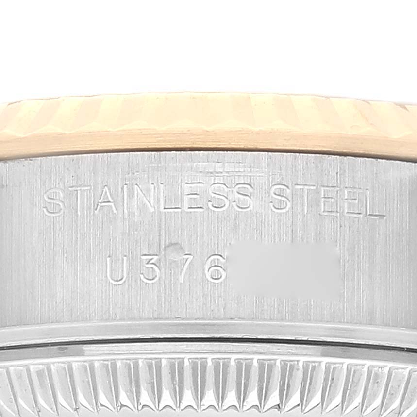 The image shows a close-up of the case side and bezel edge of a Rolex Datejust 69173 Women's Steel and Gold (two tone) Grey Dial 69173 Women's Steel and Gold (two tone) Grey Dial watch, highlighting the "Stainless Steel" engraving.